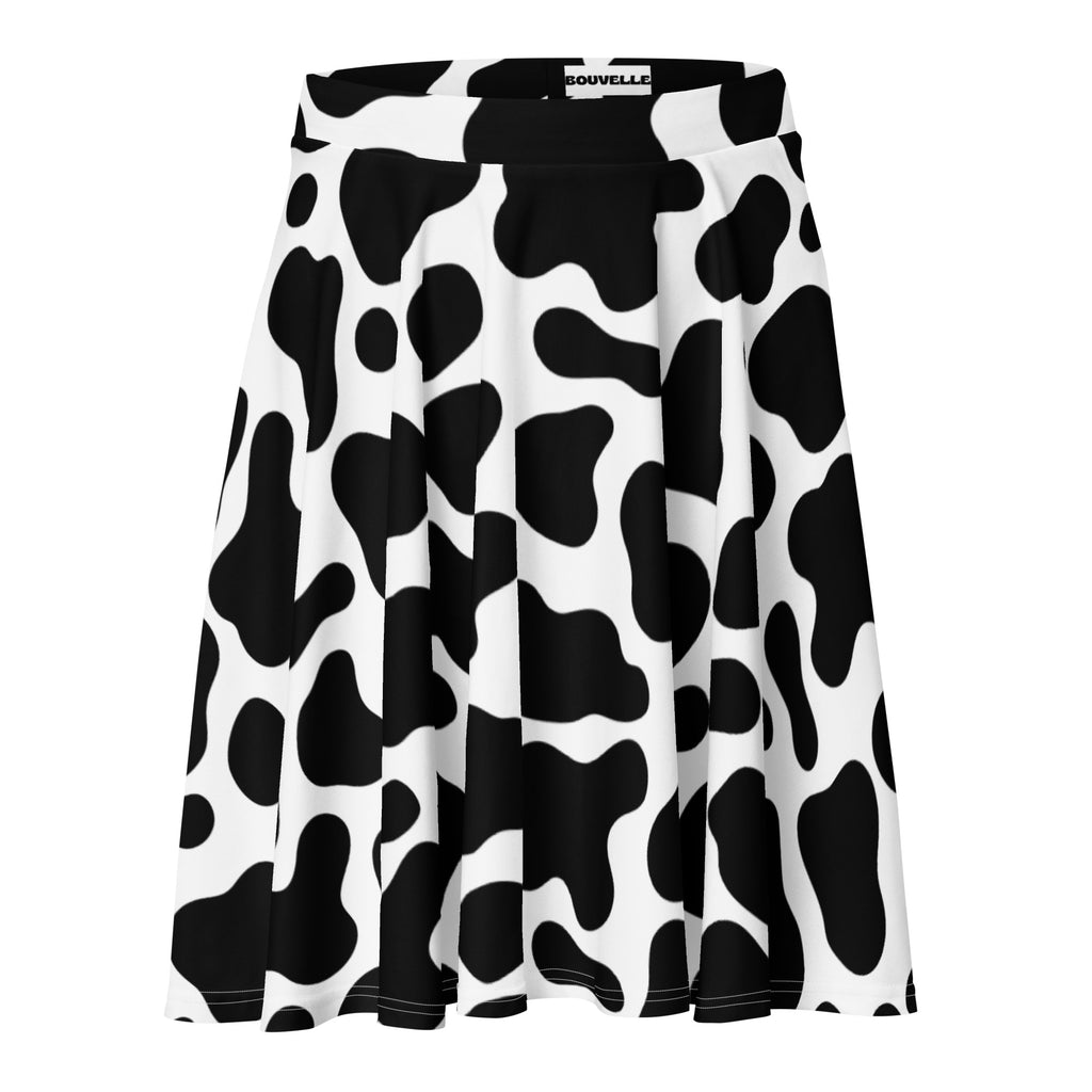 Women’s black and white cow print skater skirt with pleats branded waistband upf 50 plus recycled fabric