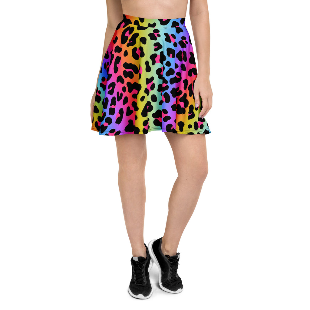 A vibrant rainbow leopard skater skirt with flowy pleats high waisted made from recycled fabric with UPF 50+ protection