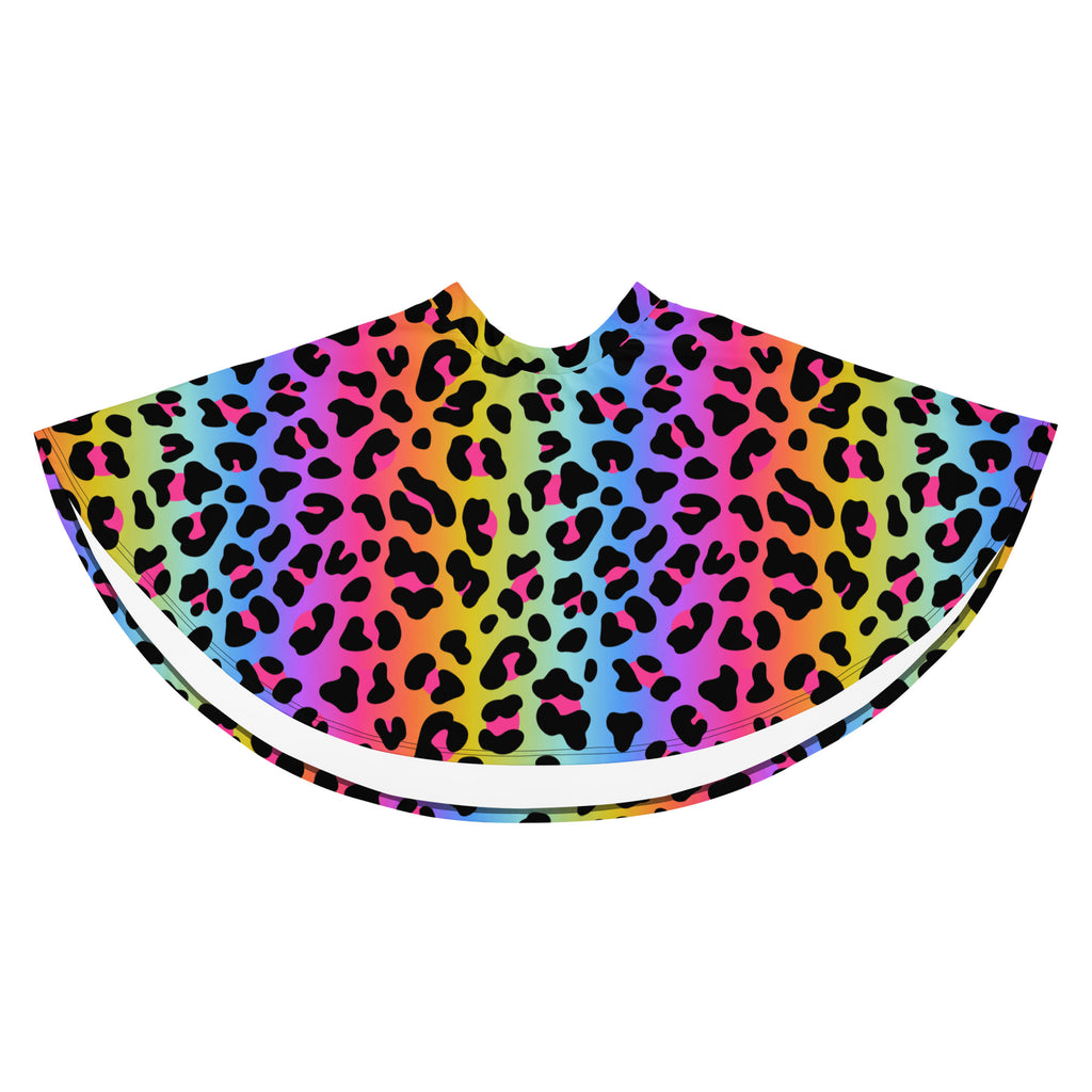 A vibrant rainbow-colored cape with bold black leopard print in recycled fabric and flowy high waisted design