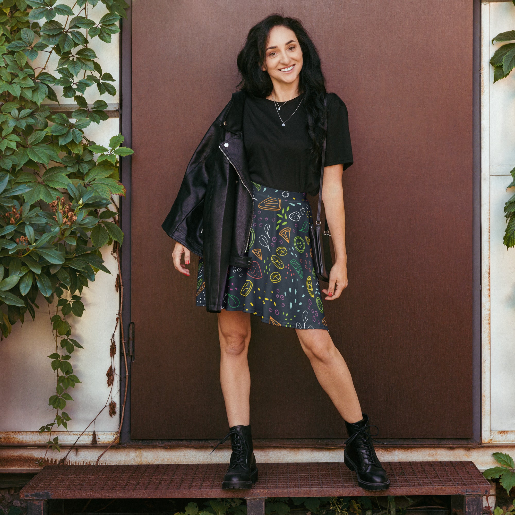 Black leather jacket with zipper detail paired with women’s neon fruit skater skirt flowy high waisted recycled fabric
