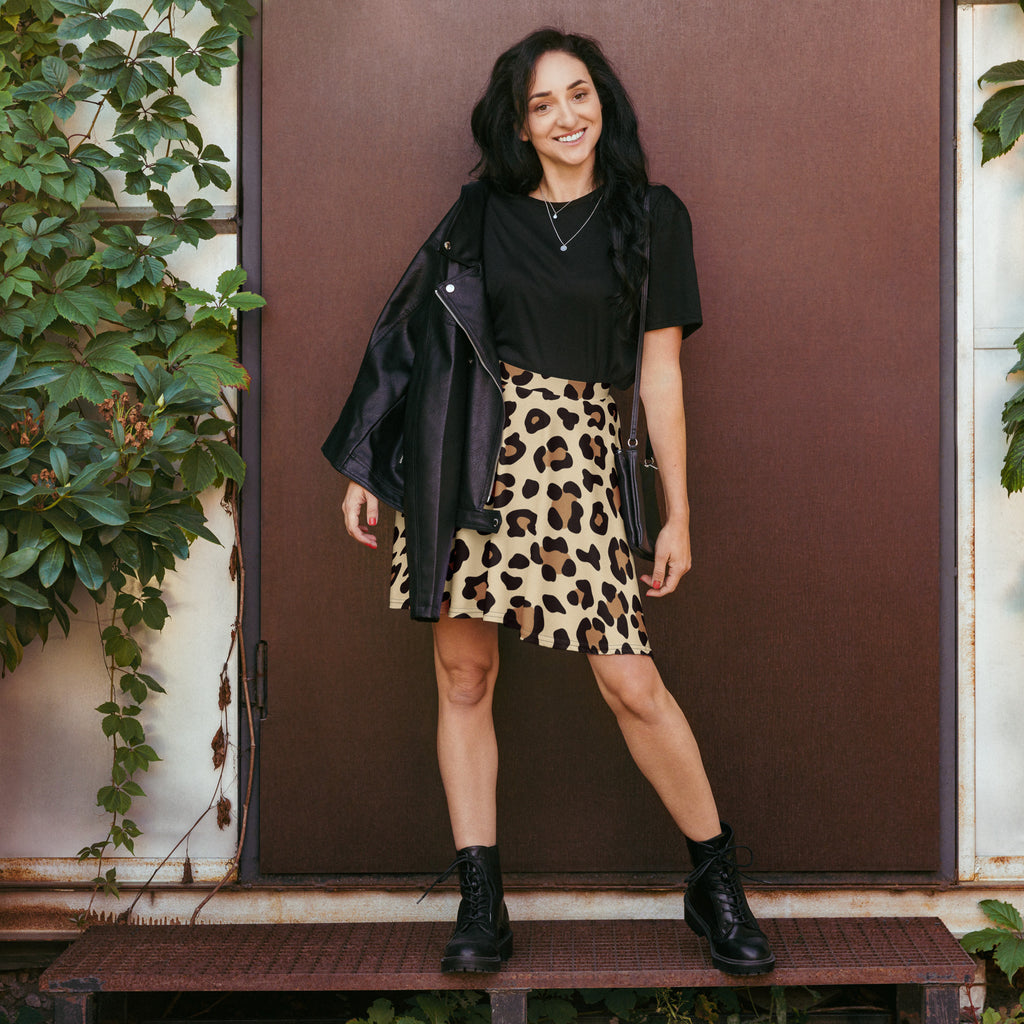 Black leather jacket with zipper details and matte finish paired with women’s leopard print skater skirt high waisted and flowy