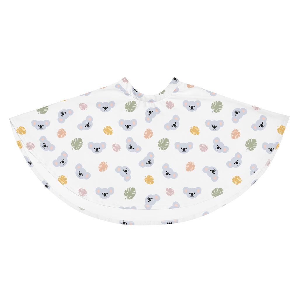 White children’s cape with playful gray koalas and muted tropical leaves pattern in soft green yellow and pink tones