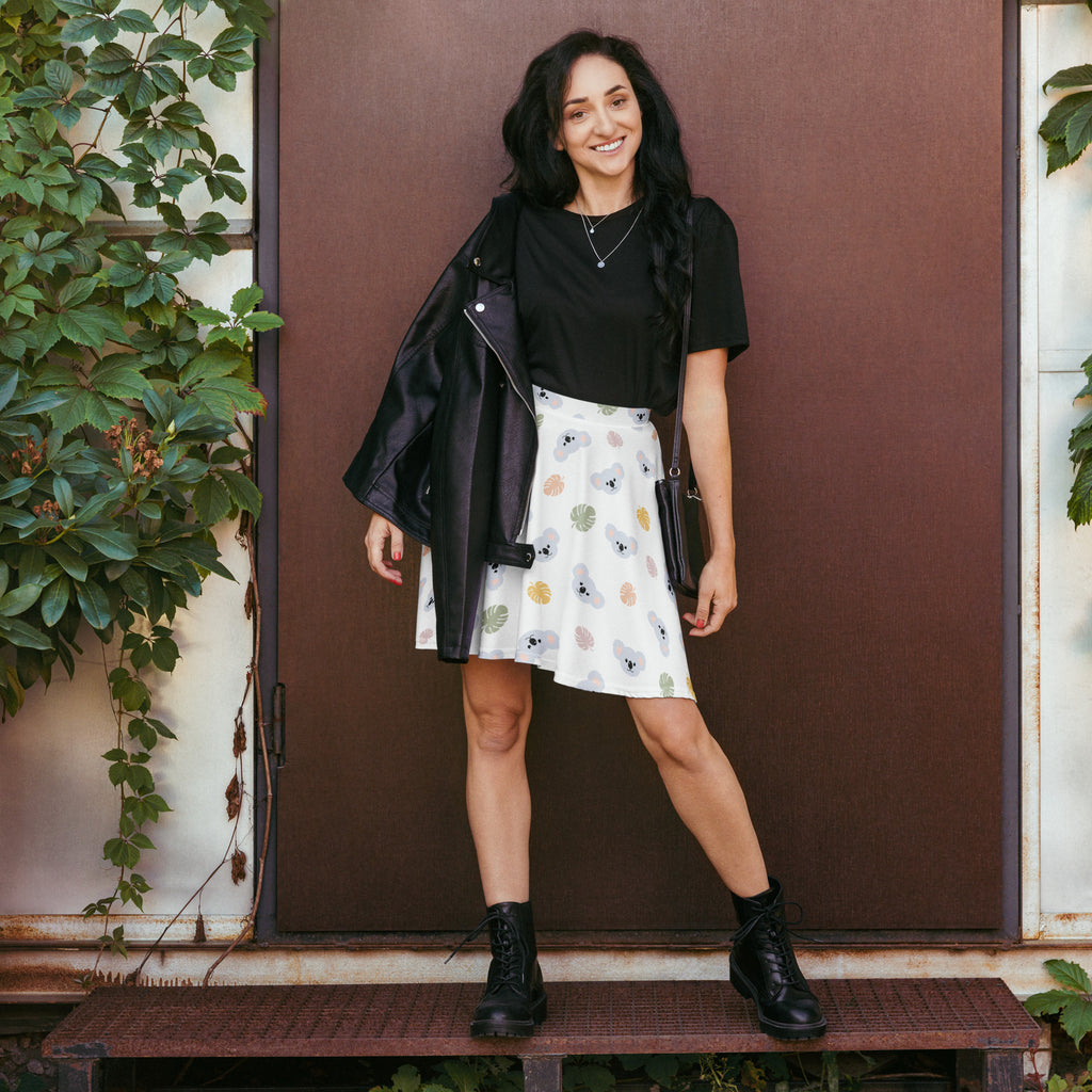 Black leather jacket with zipper details and collar paired with women’s koala print skater skirt flowy high waisted