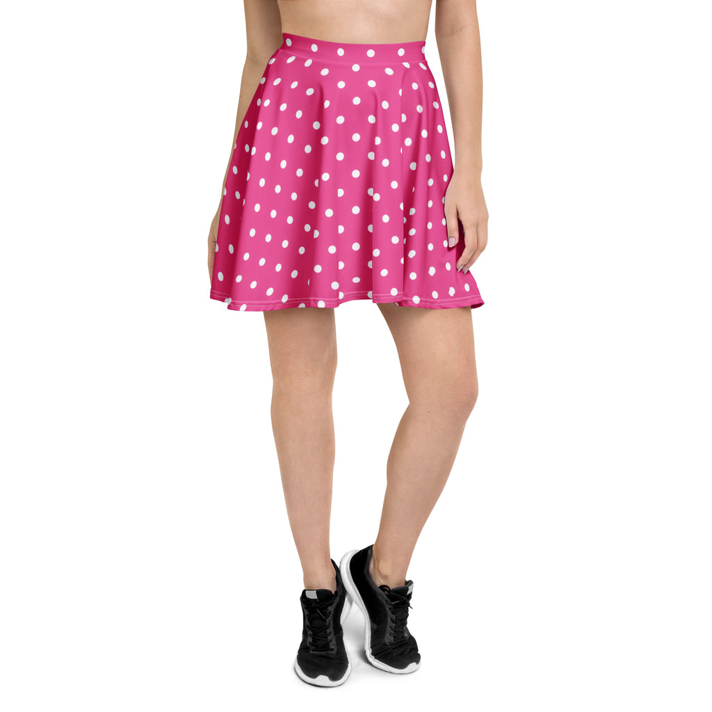 A vibrant pink pleated skater skirt with white polka dots made from recycled fabric and UPF 50 plus protection