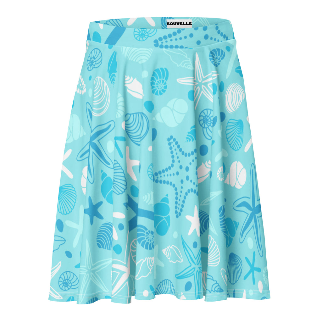 A light blue womens starfish and shells skater skirt with pleats flowy high waisted upf 50 plus recycled fabric