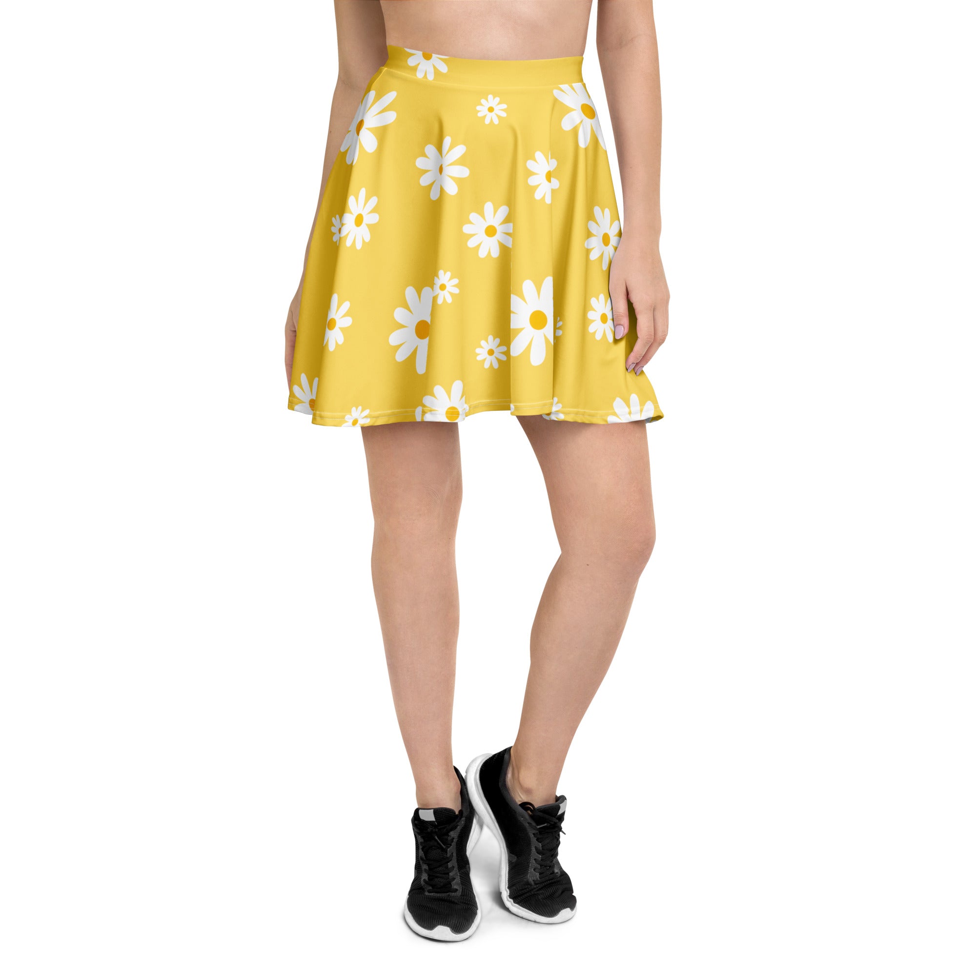 A vibrant yellow pleated women’s skater skirt with white daisies high waisted made from recycled fabric with UPF 50+