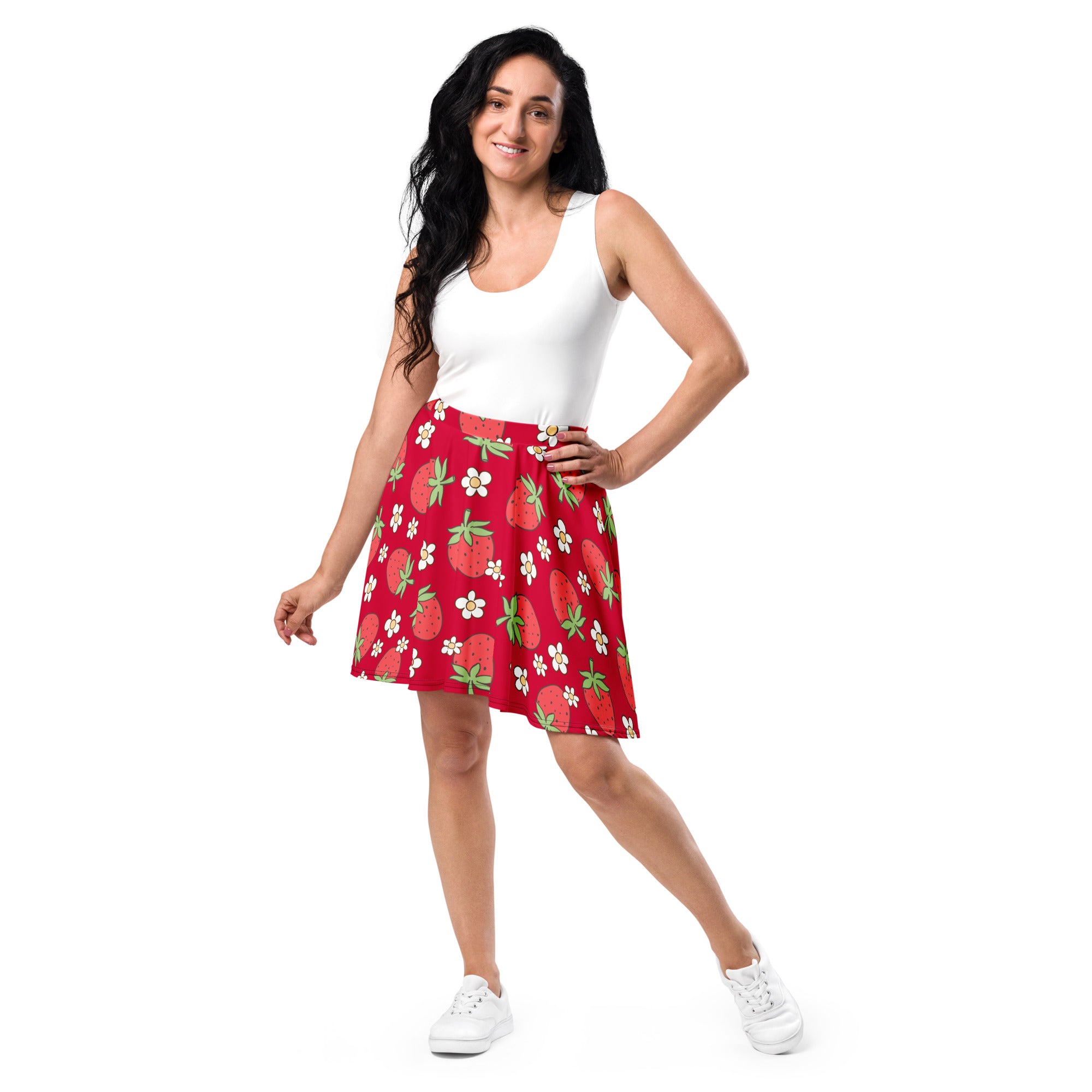 A vibrant red women’s a-line skater skirt with strawberry and white flower print made from recycled fabric with UPF 50+