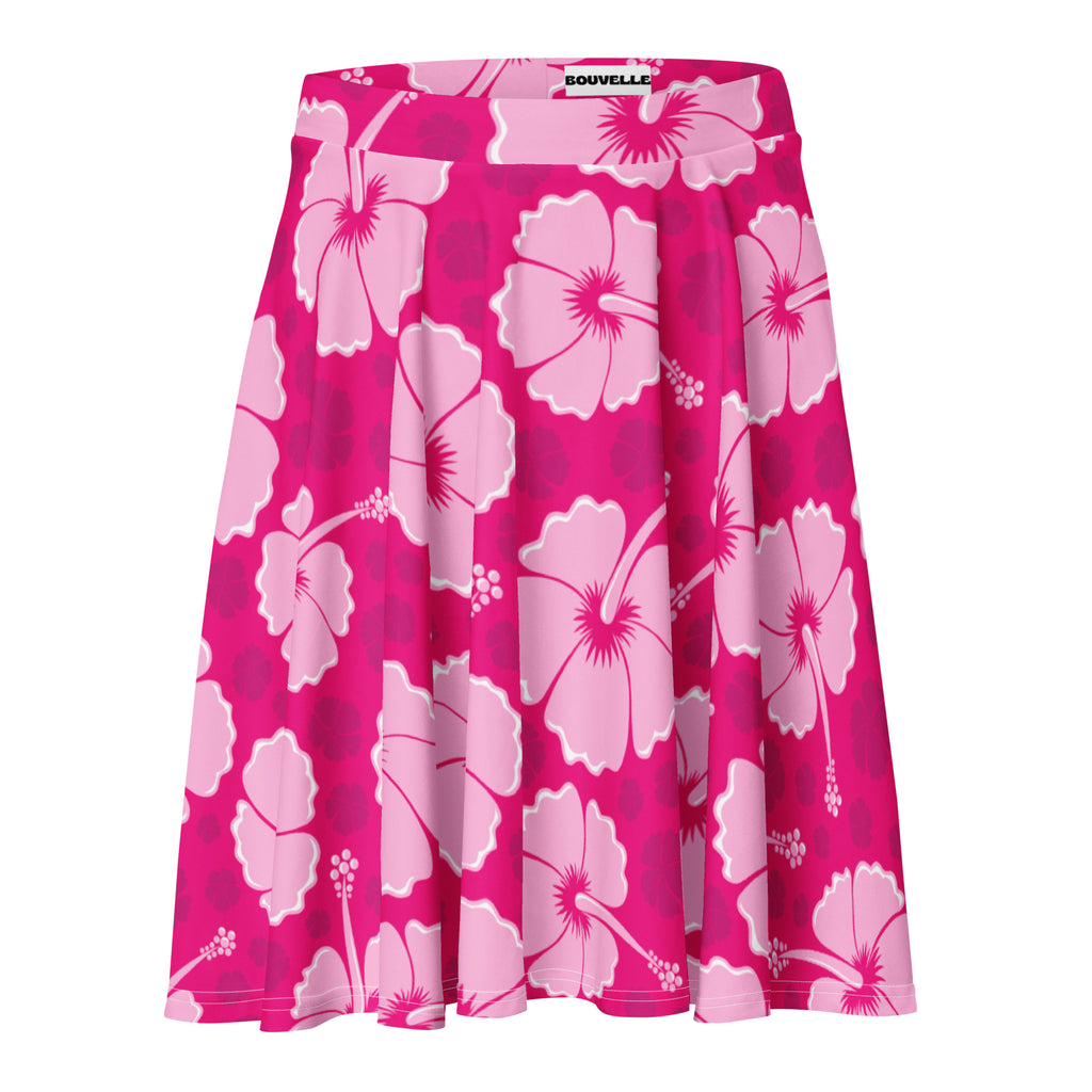 A vibrant pink pleated skater skirt with white and magenta hibiscus flowers by bouvelle with upf 50 and recycled fabric