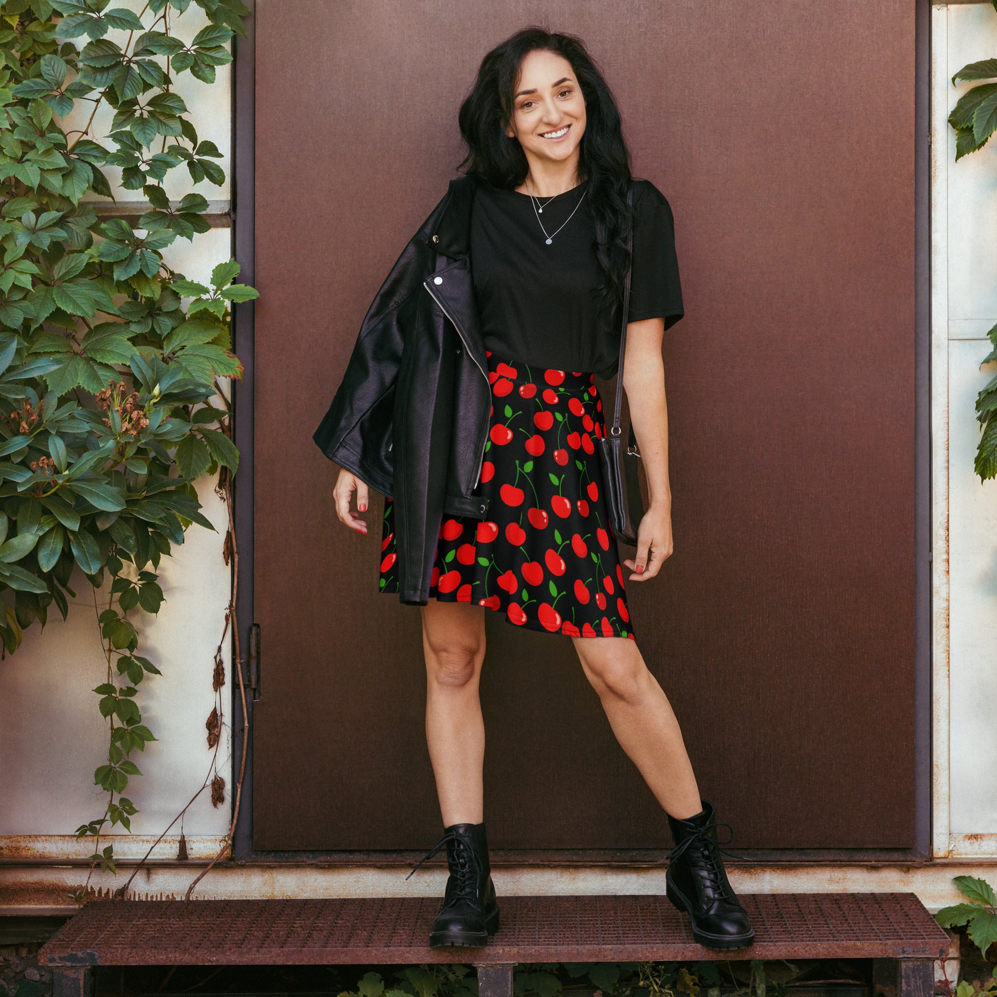 Women’s black cherry skater skirt with vibrant red cherry pattern green stems flowy high waisted recycled fabric upf 50+