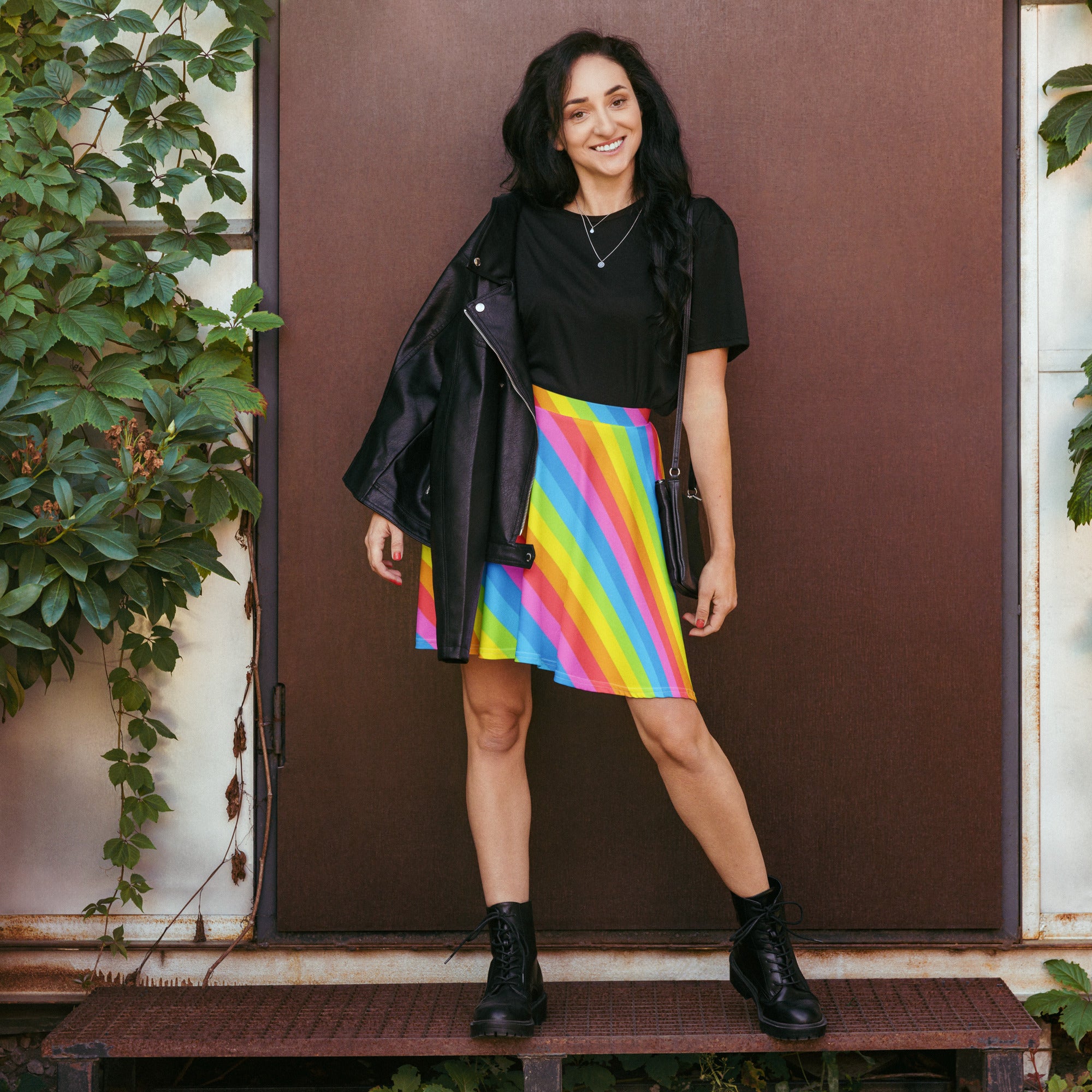 Women’s rainbow stripe skater skirt with bold diagonal pink yellow blue green stripes flowy high waisted recycled fabric upf 50+