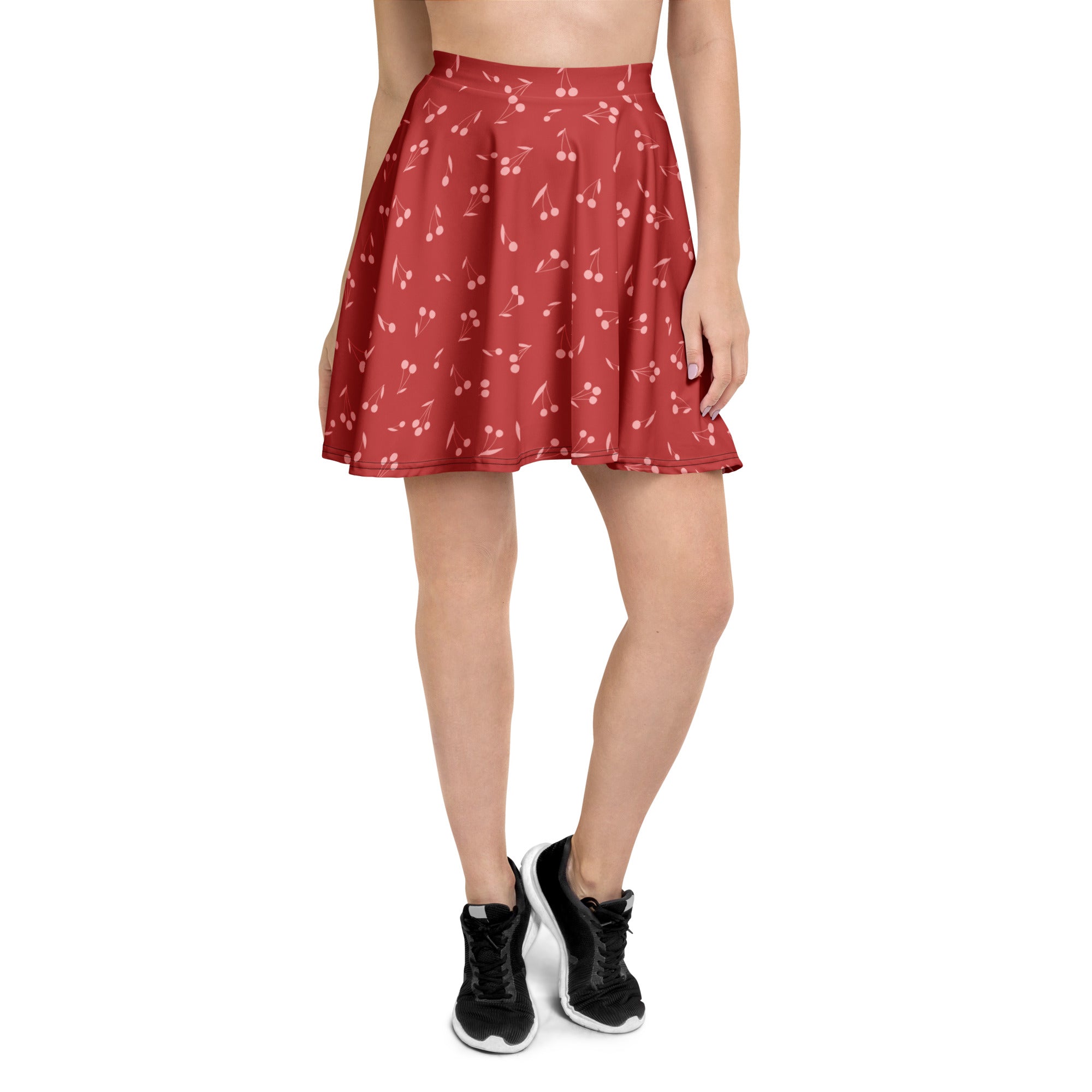 A red cherry-print womens minimal skater skirt with high waist soft flowy fabric upf 50 plus recycled fabric