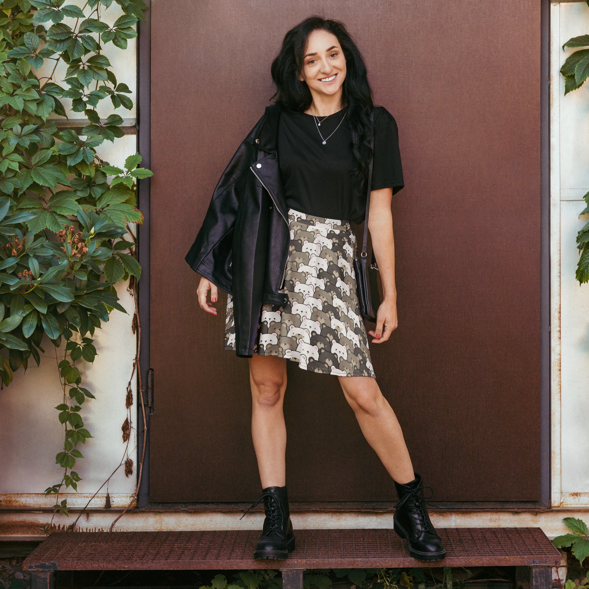 A black leather jacket with zipper detail paired with a women’s cute bear skater skirt high waisted flowy with upf 50+