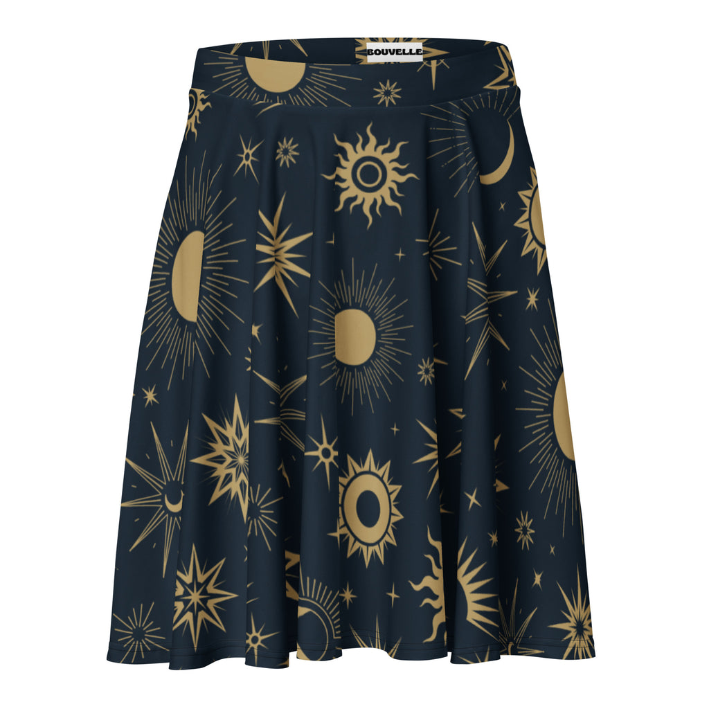 A navy blue women’s celestial sun and moon skater skirt with vibrant gold print, flowy high waisted and recycled fabric