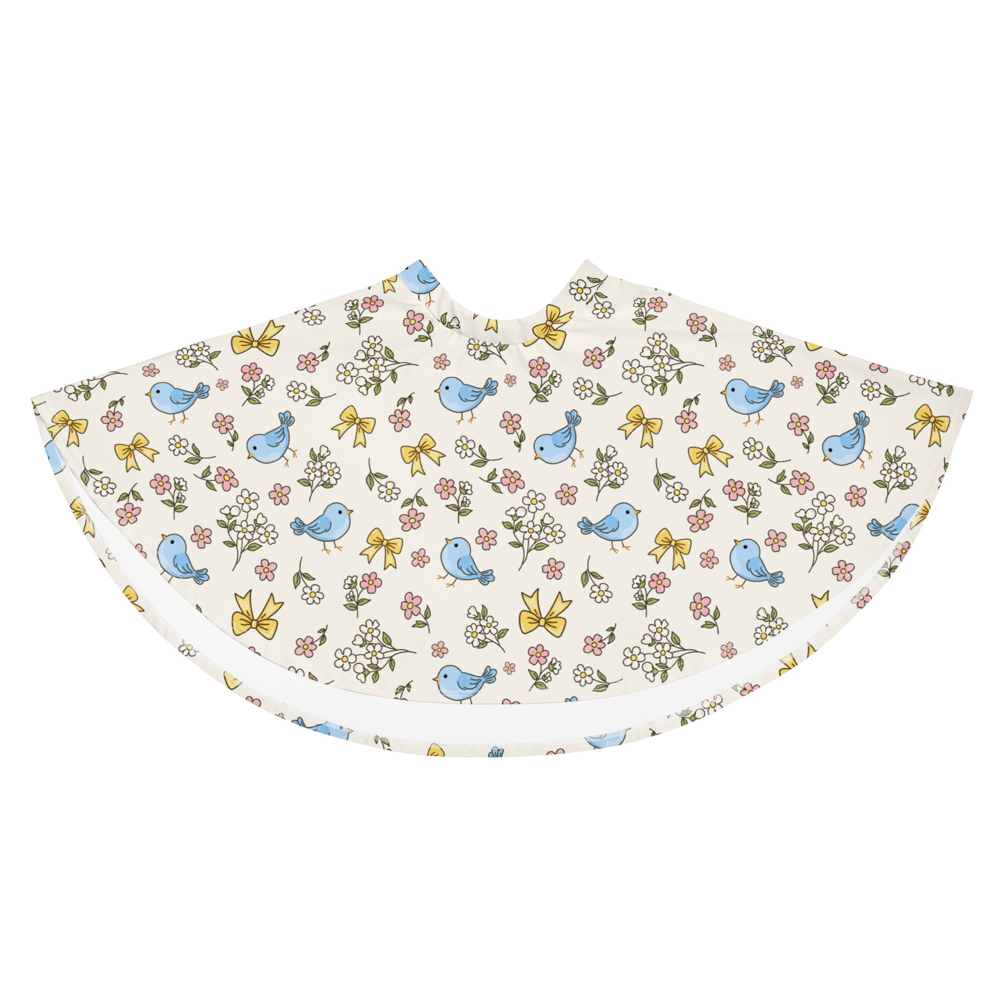 A delicate cream fabric cape with blue birds pink and white flowers and yellow bows complementing women’s blue bird skater skirt