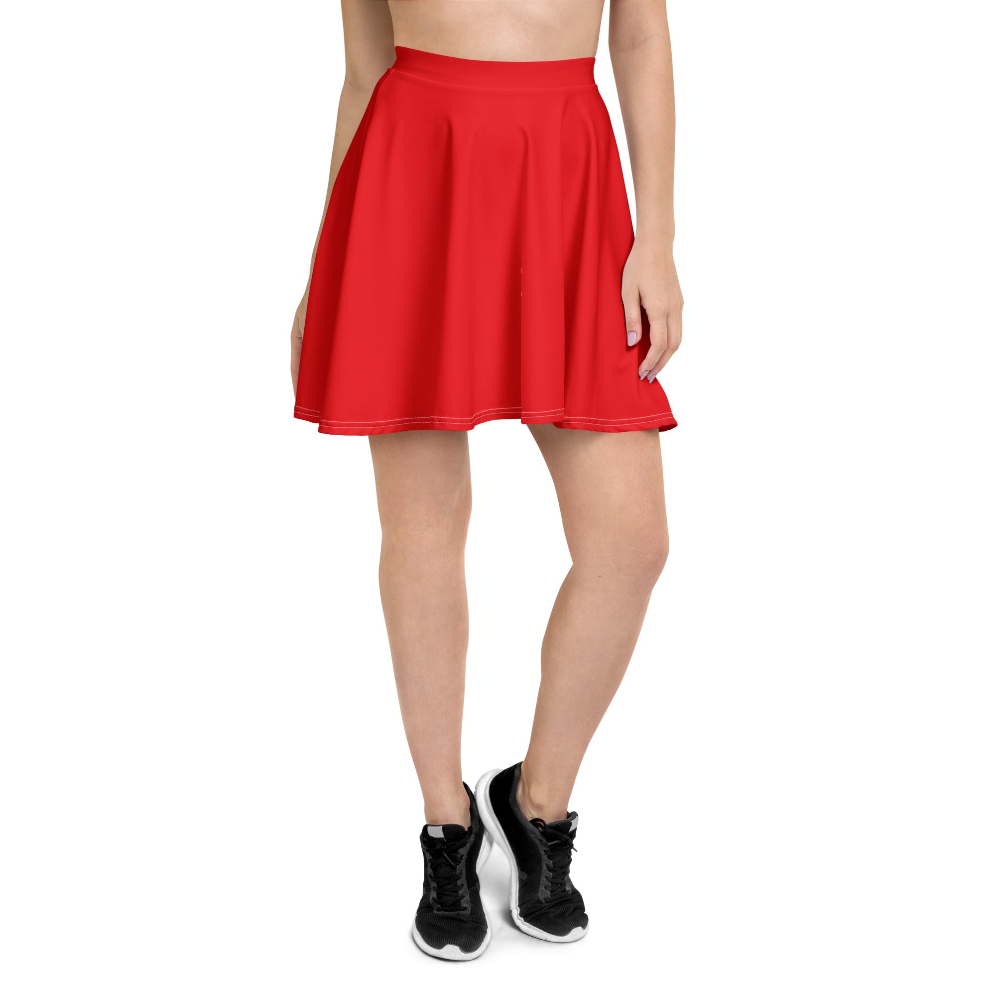 A vibrant red high waisted pleated skater skirt with smooth recycled fabric and matching hem stitching with UPF 50+ protection