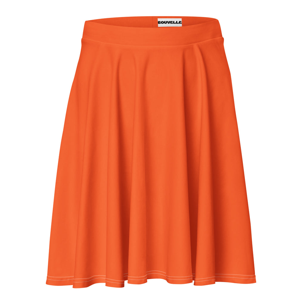 Bright orange high waisted skater skirt with pleats, soft stretchy recycled fabric, subtle white stitching, UPF 50 plus protection
