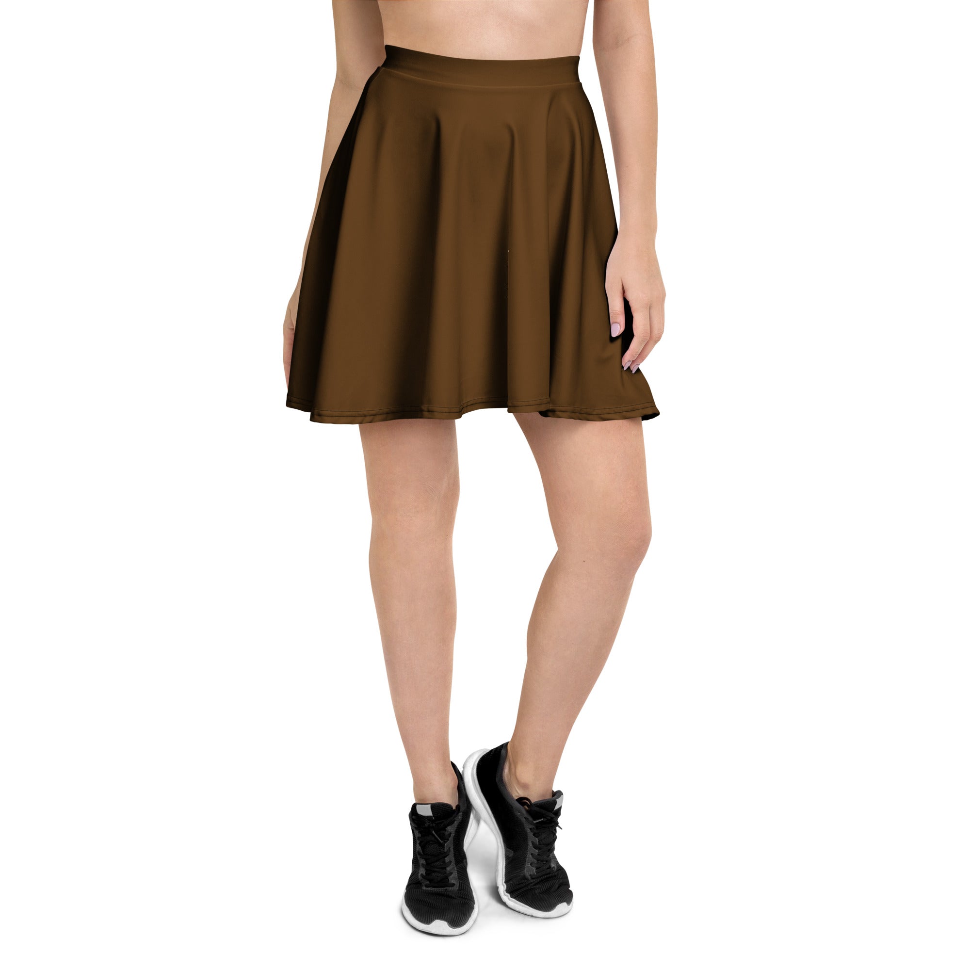 A brown pleated skater skirt with a fitted waistband flared hem made with recycled fabric and UPF 50 plus protection