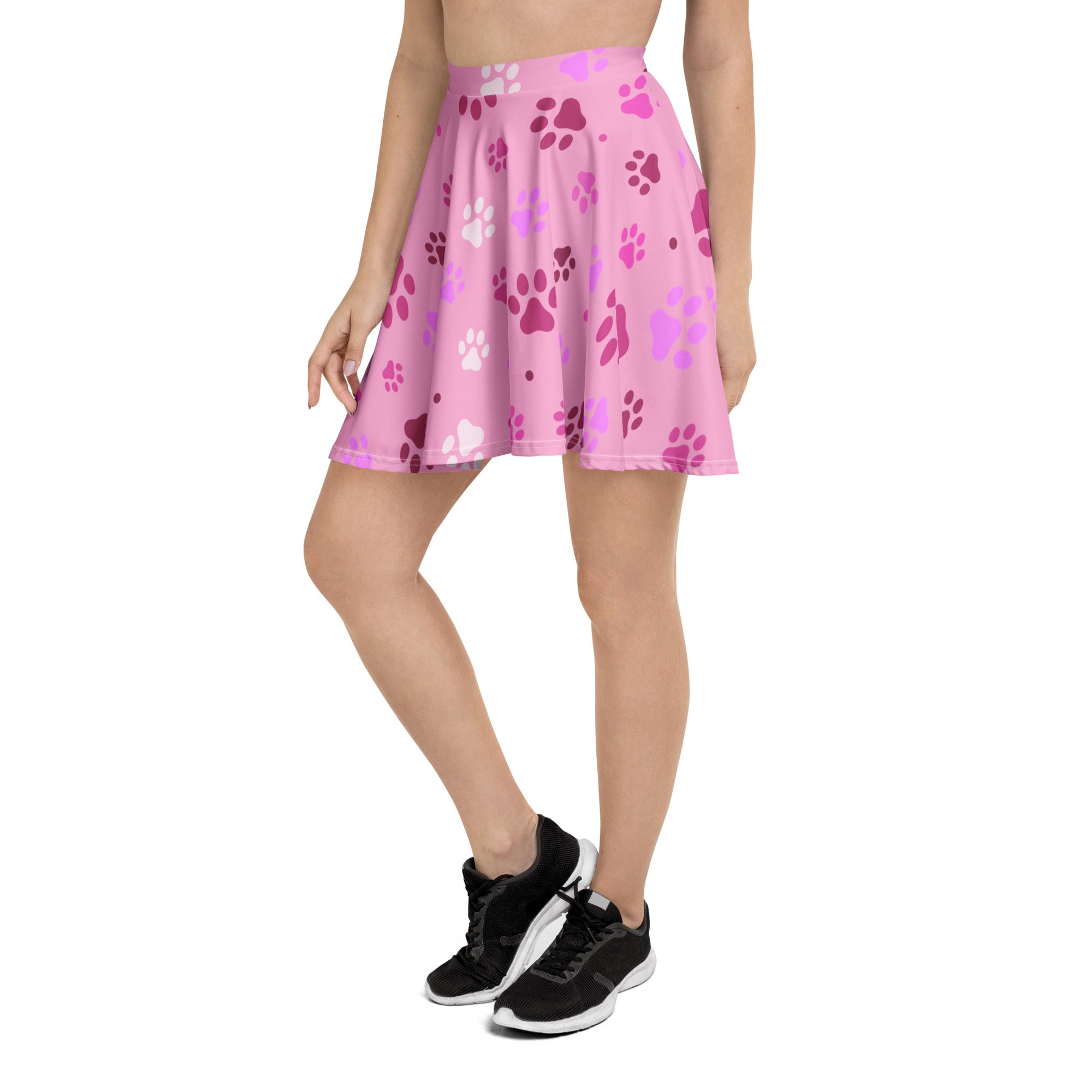 Women’s pink paw print skater skirt with playful white and darker pink paw prints made from recycled fabric