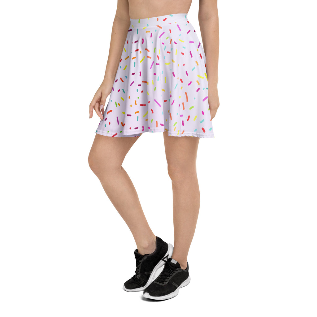 A white pleated skater skirt with colorful sprinkles pattern made from recycled fabric and upf 50 plus protection