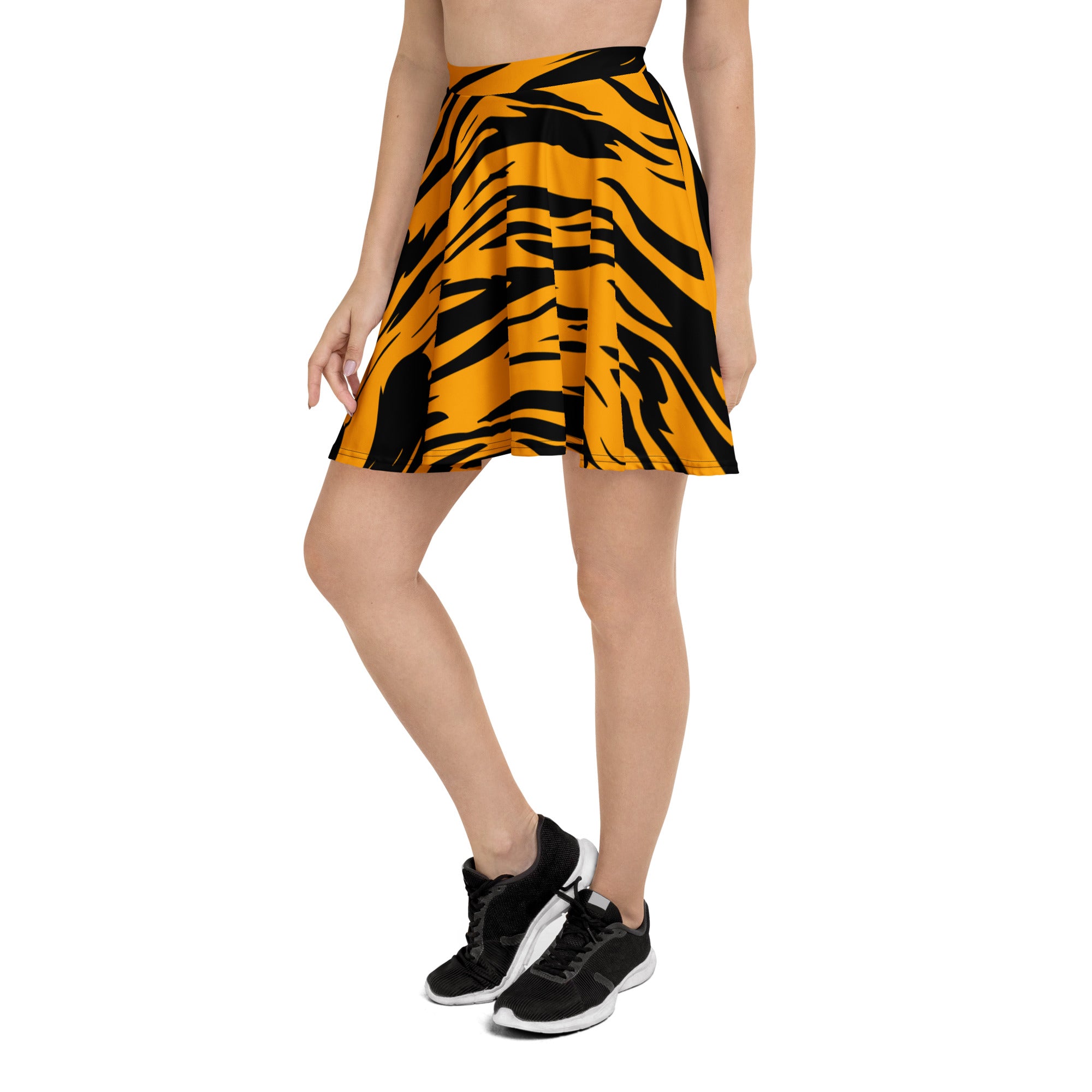 A vibrant yellow and black tiger print flared skater skirt with high waist made from recycled fabric and UPF 50+ protection