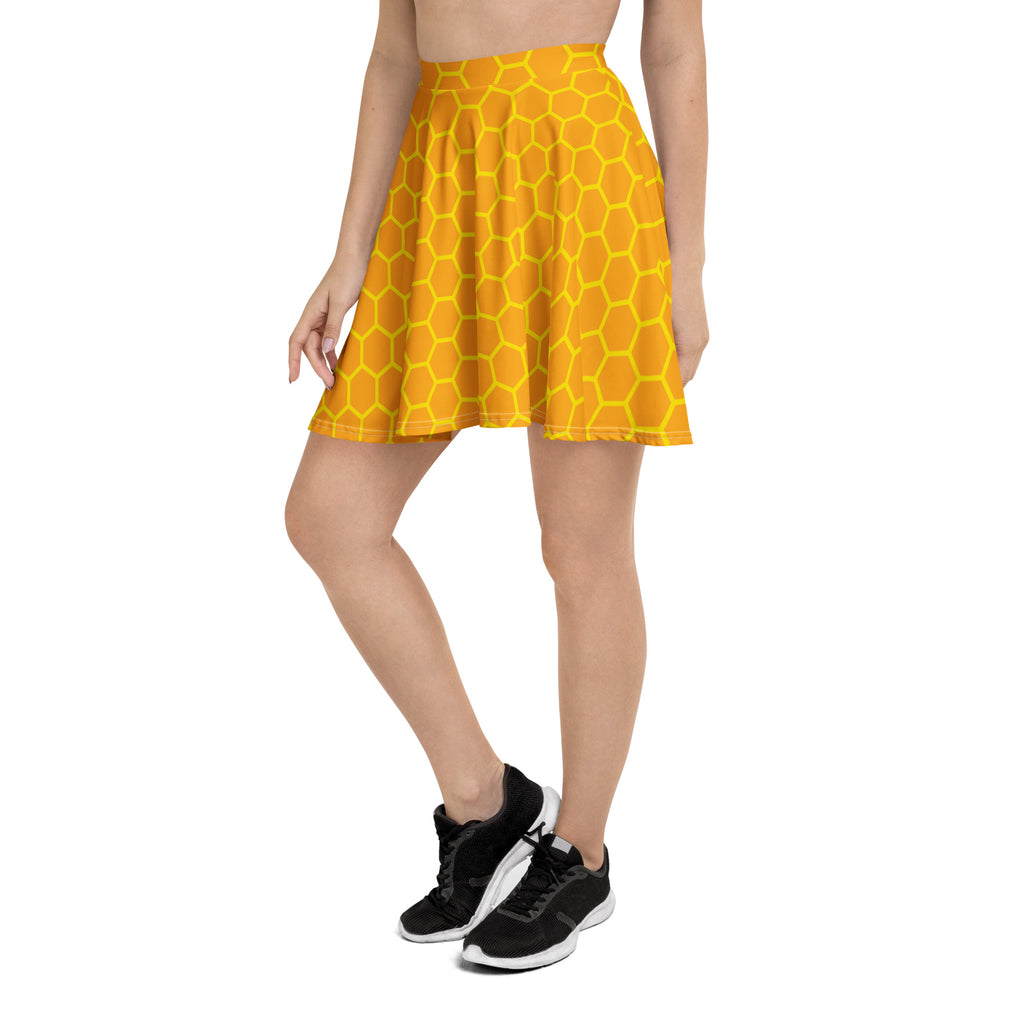 A vibrant yellow women’s honeycomb skater skirt with pleats flowy high waisted made from recycled fabric with UPF 50+