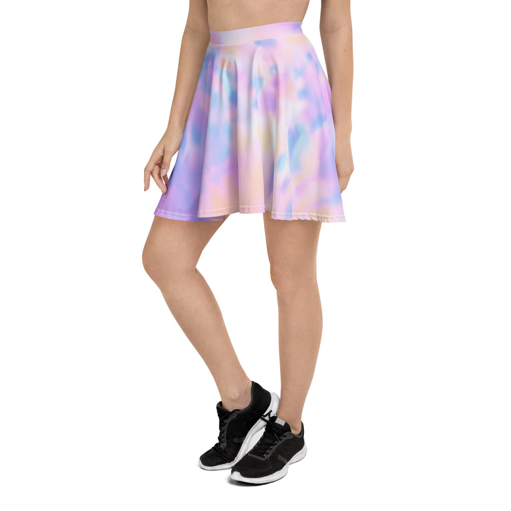 A flowing pleated women’s skater skirt with pastel lavender pink and blue tie dye made from recycled fabric with upf 50+