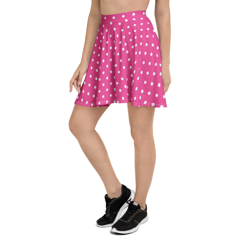 A vibrant pink polka dot skater skirt with a flared high waisted design made from recycled fabric with UPF 50+ protection