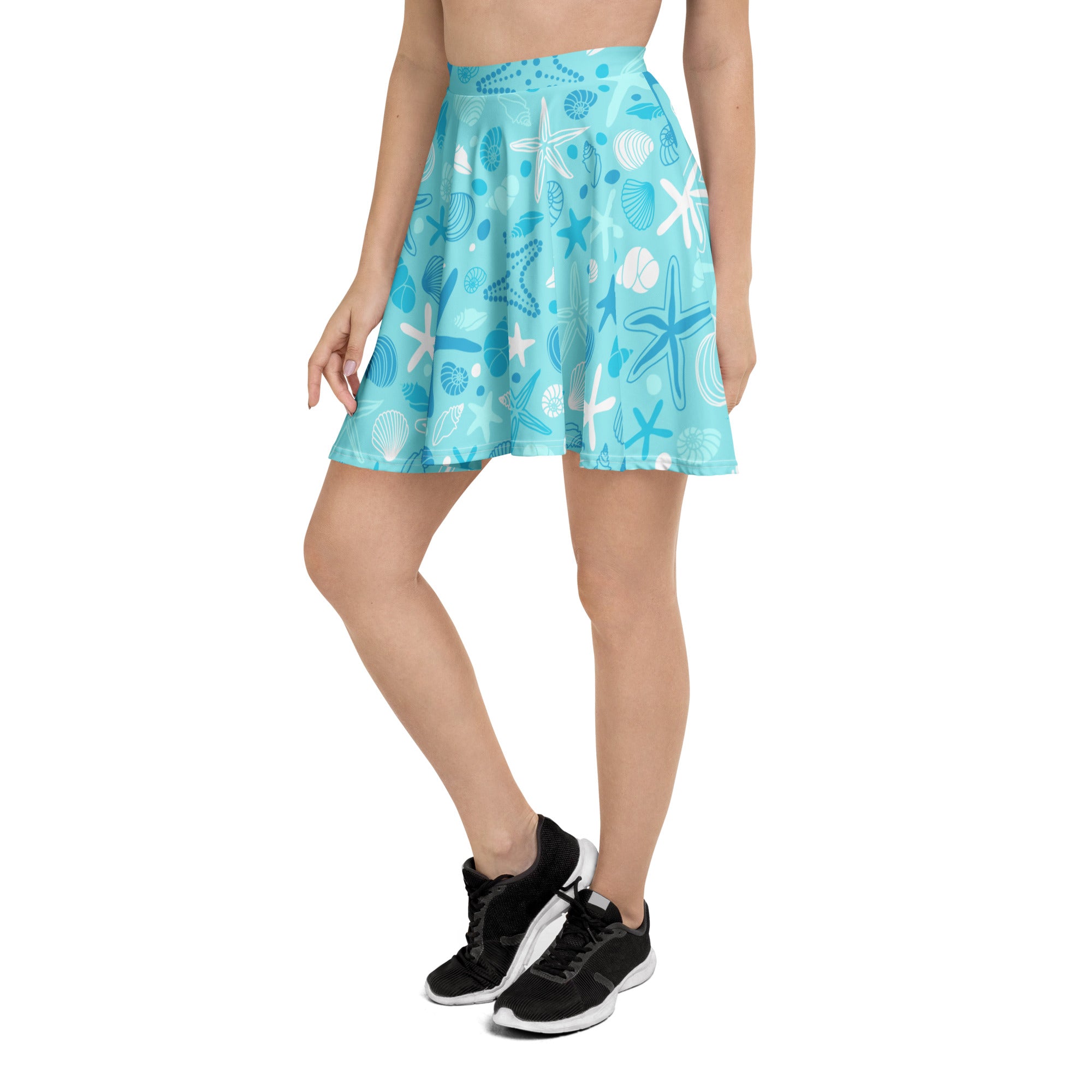 A light blue women’s starfish and shells skater skirt with flowy high waist upf 50 and recycled fabric features playful sea creatures