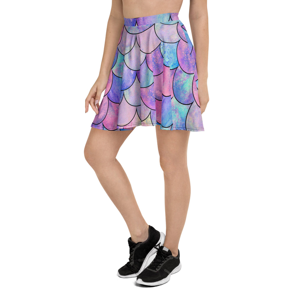 Women’s pastel mermaid skater skirt with a flared iridescent purple pink blue mermaid scale pattern made from recycled fabric