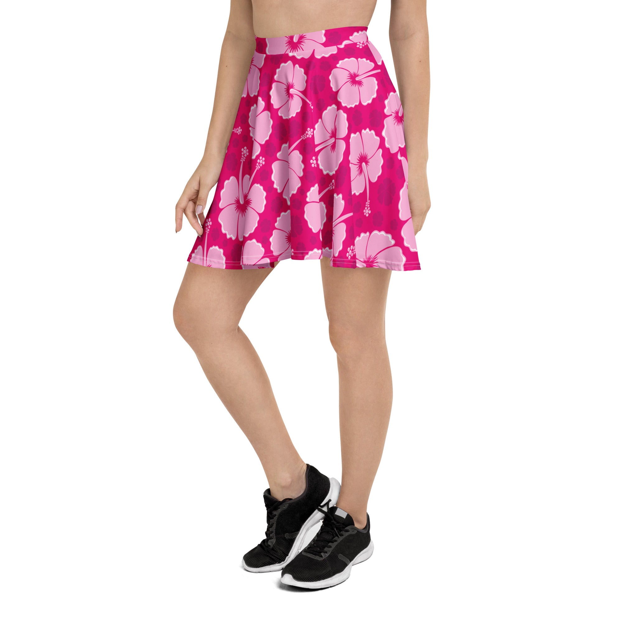 A vibrant pink flared skater skirt with light pink hibiscus flowers made from recycled fabric with UPF 50+ protection