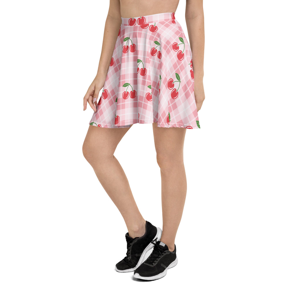 Women’s pink plaid cherry skater skirt with red cherries made from lightweight recycled fabric with upf 50+ protection