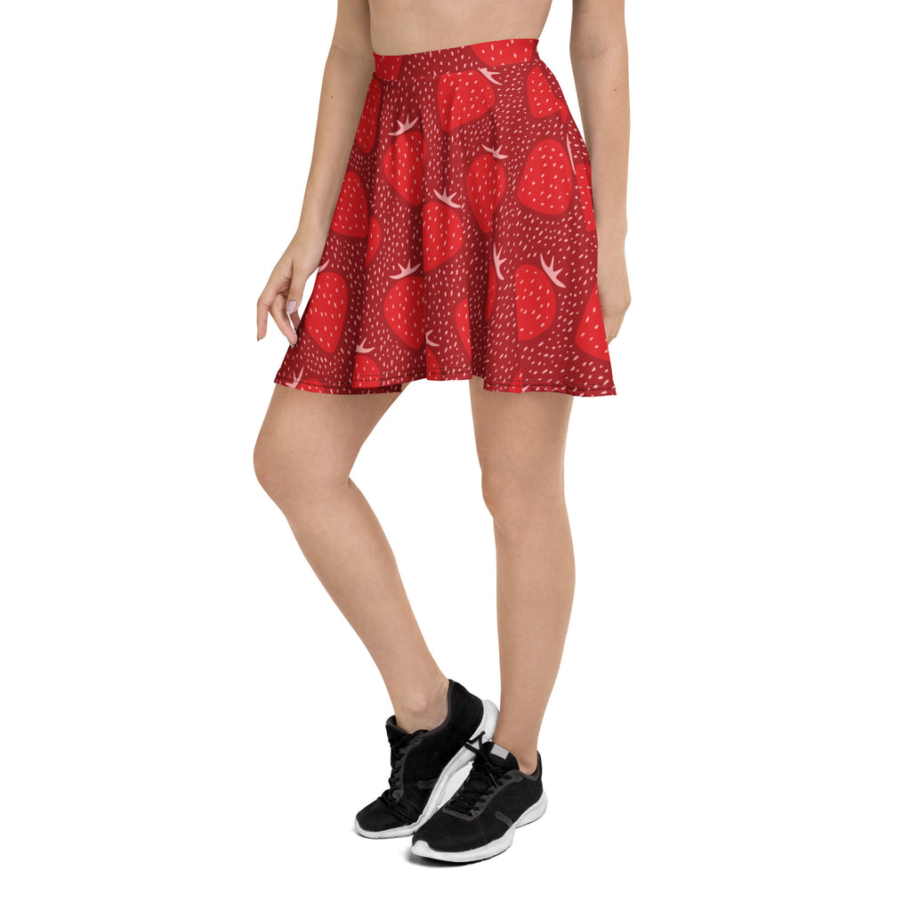 A red strawberry patterned women’s skater skirt with white bird accents flowy high waisted with upf 50 plus and recycled fabric