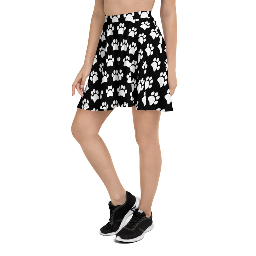 Women’s black pleated skater skirt with white paw print pattern high waisted flowy fabric with upf 50 plus protection