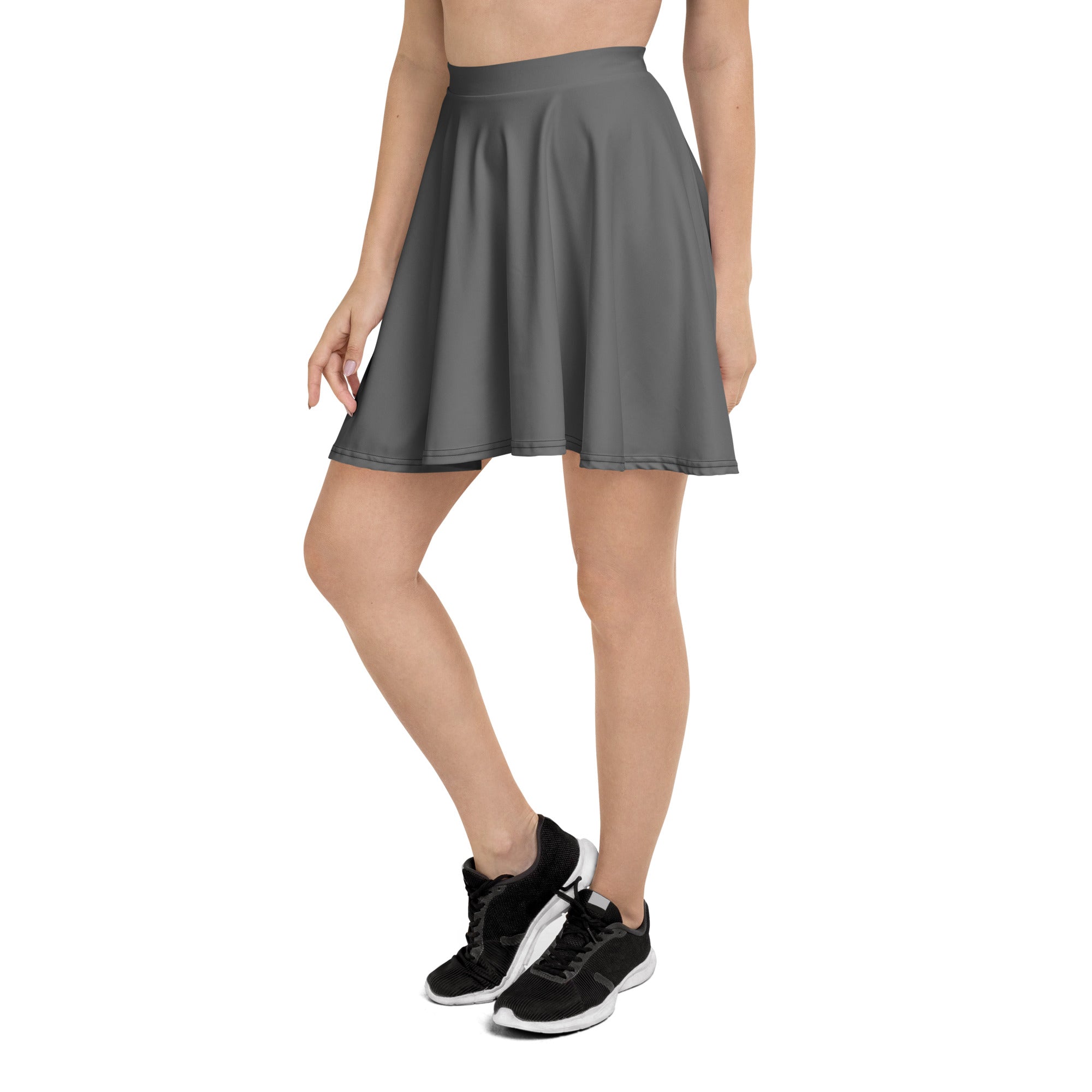 A sleek dark gray pleated skater skirt with a high waistband made from recycled fabric and UPF 50 plus protection