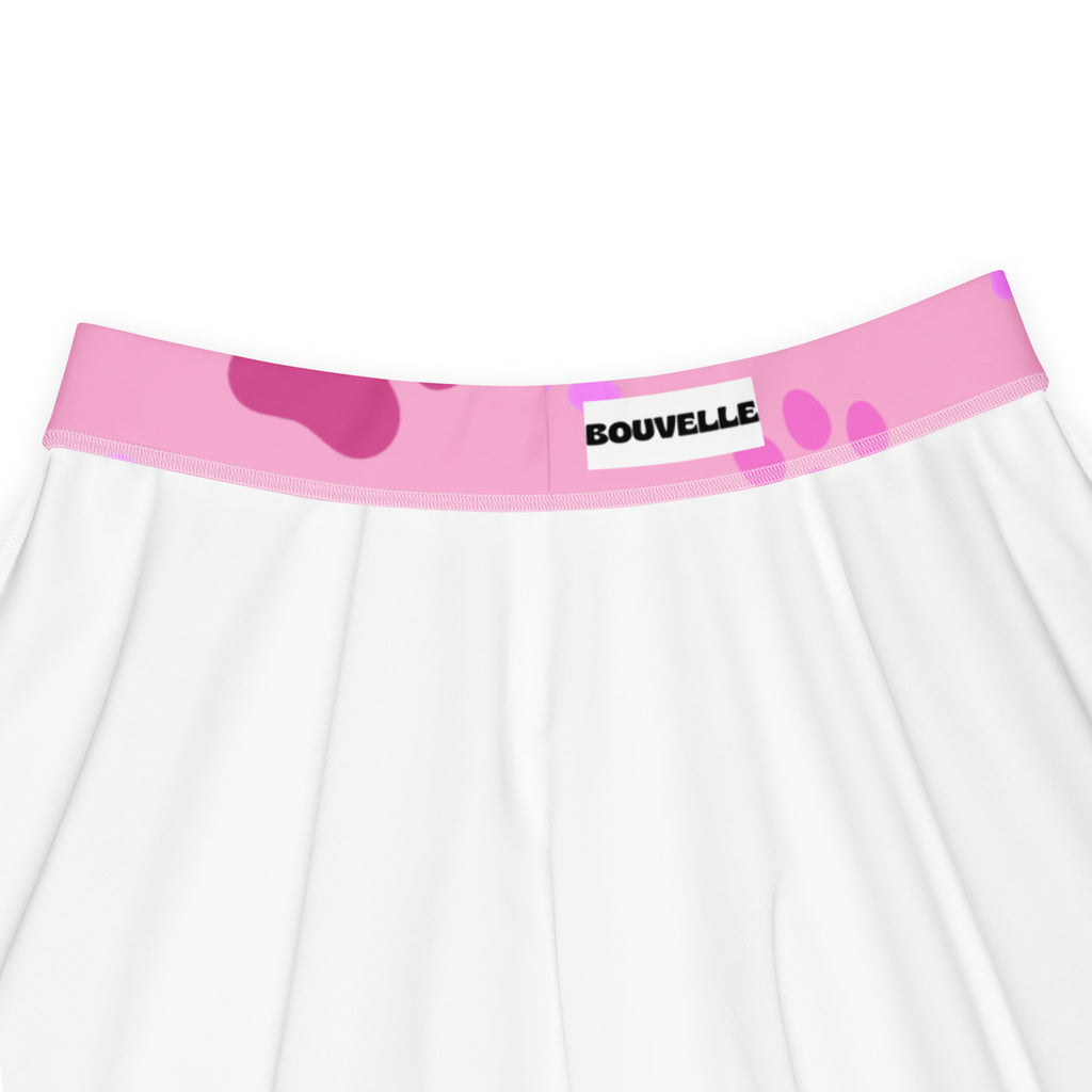White skirt with pink paw print waistband featuring bouvelle label flowy high waisted upf 50 plus recycled fabric
