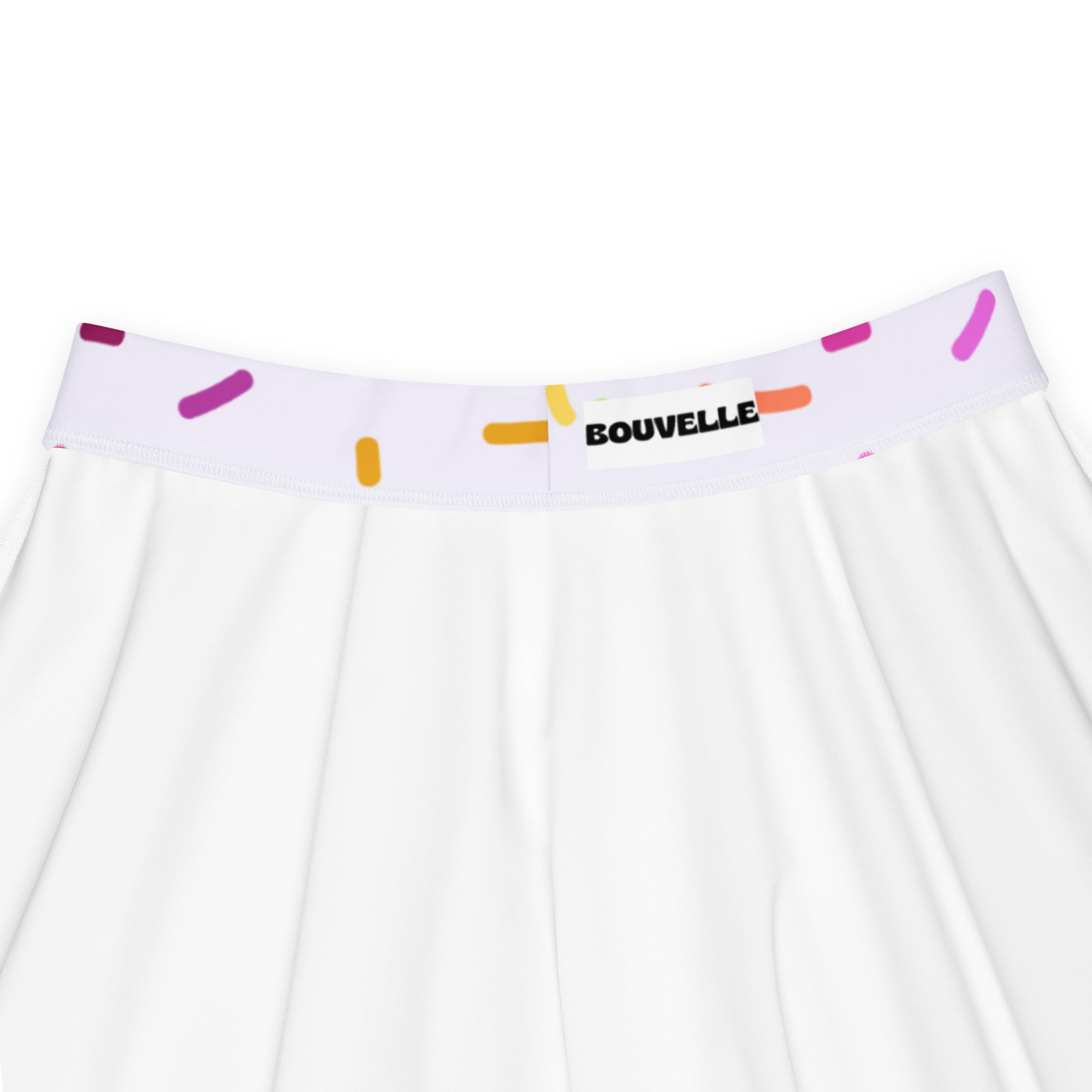 White pleated skater skirt with colorful sprinkle waistband and bouvelle label made from recycled fabric with upf 50+
