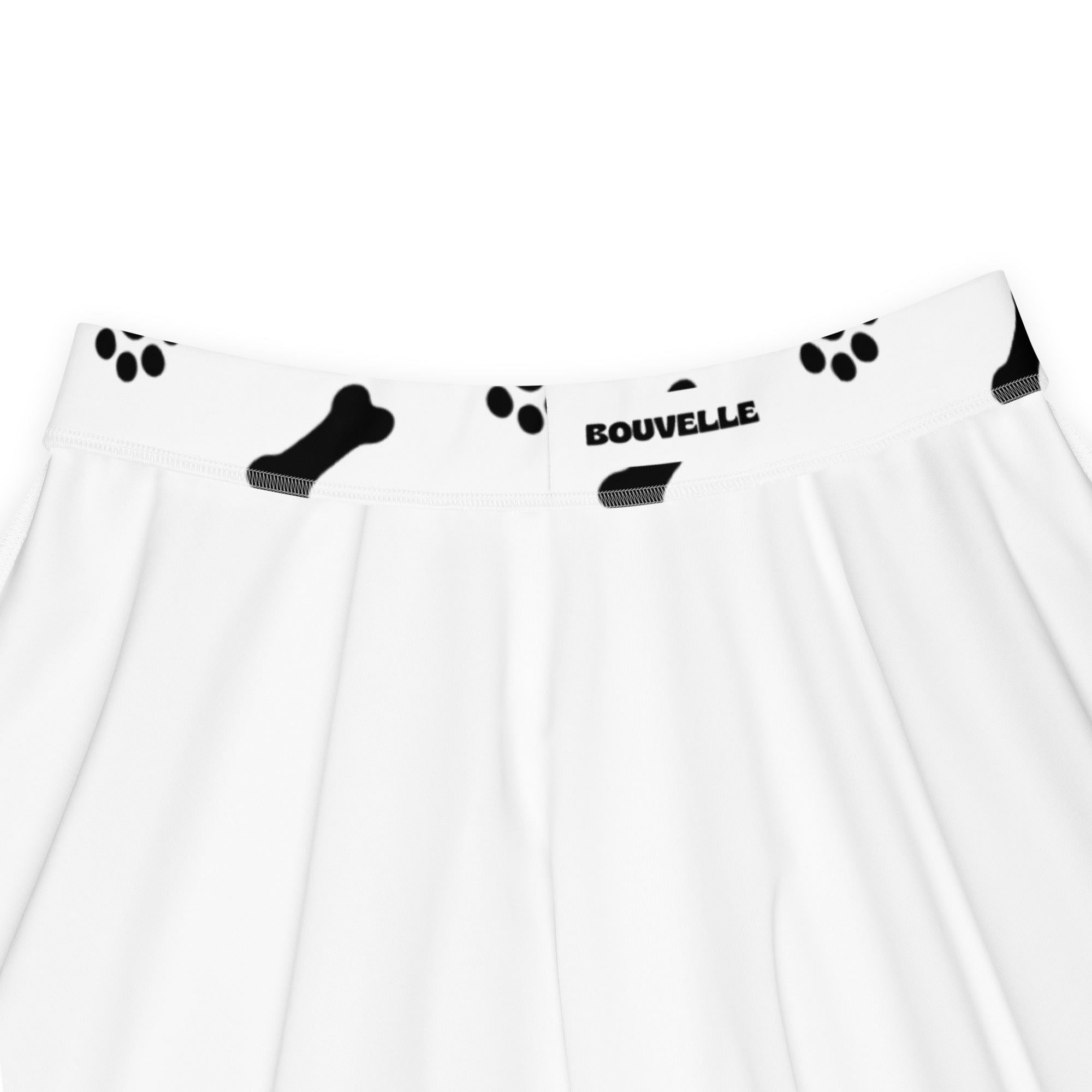 White women’s underwear with black paw prints and bones featuring bouvelle waistband branding in recycled fabric