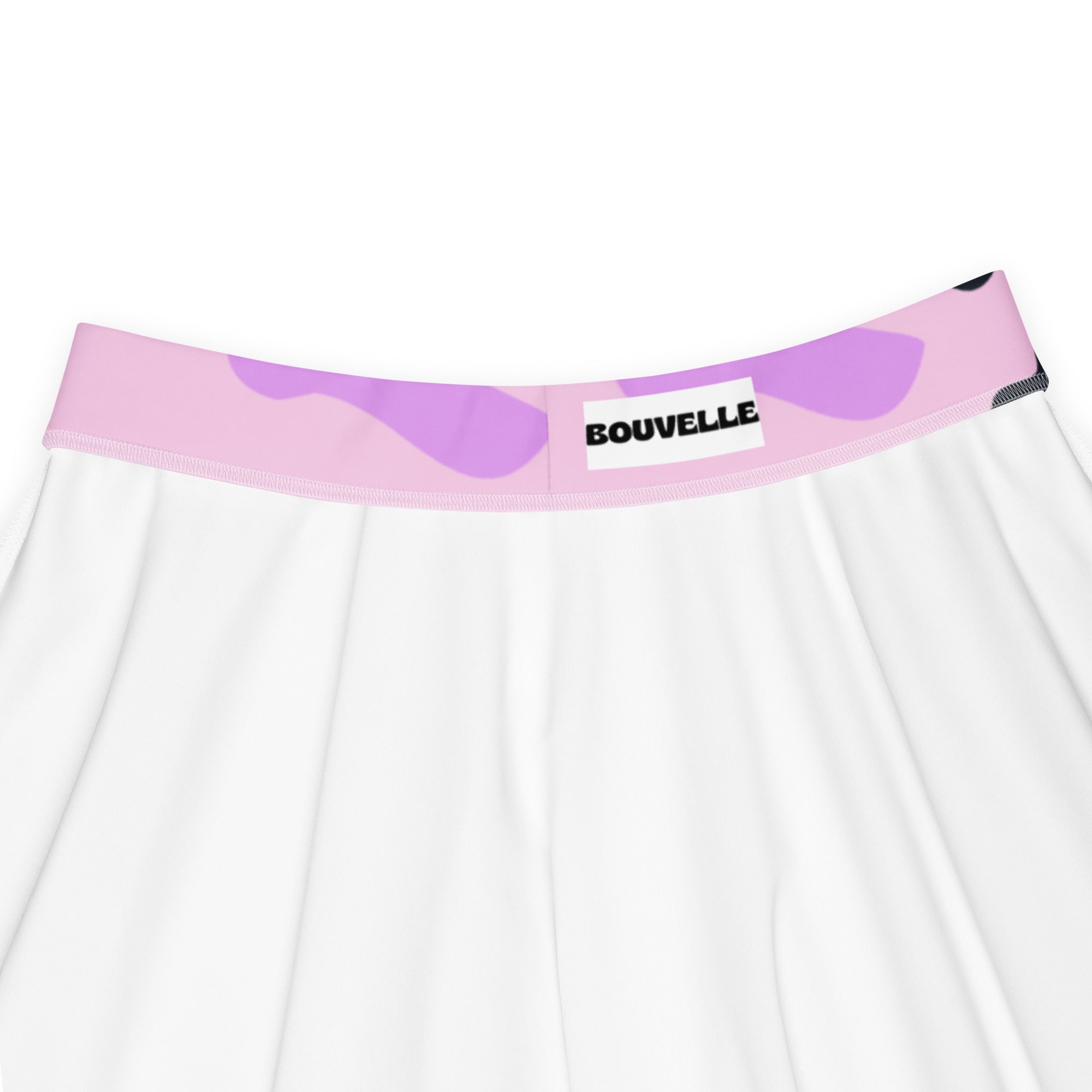 White pleated skirt with pink and lavender camouflage waistband and bouvelle label in recycled fabric with upf 50+