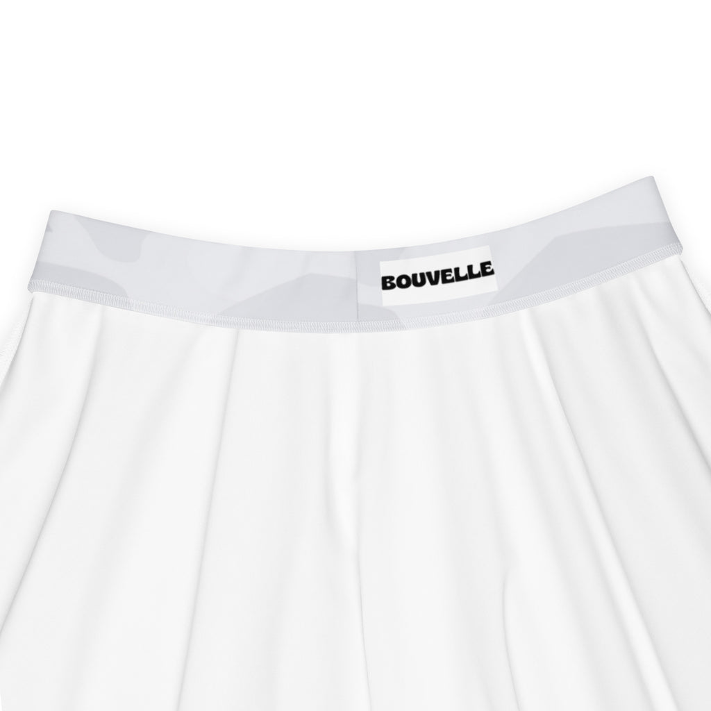Women’s light gray skater skirt with flowy high waist and upf 50 plus made from recycled fabric paired with white bouvelle branded underwear with gray geometric elastic waistband