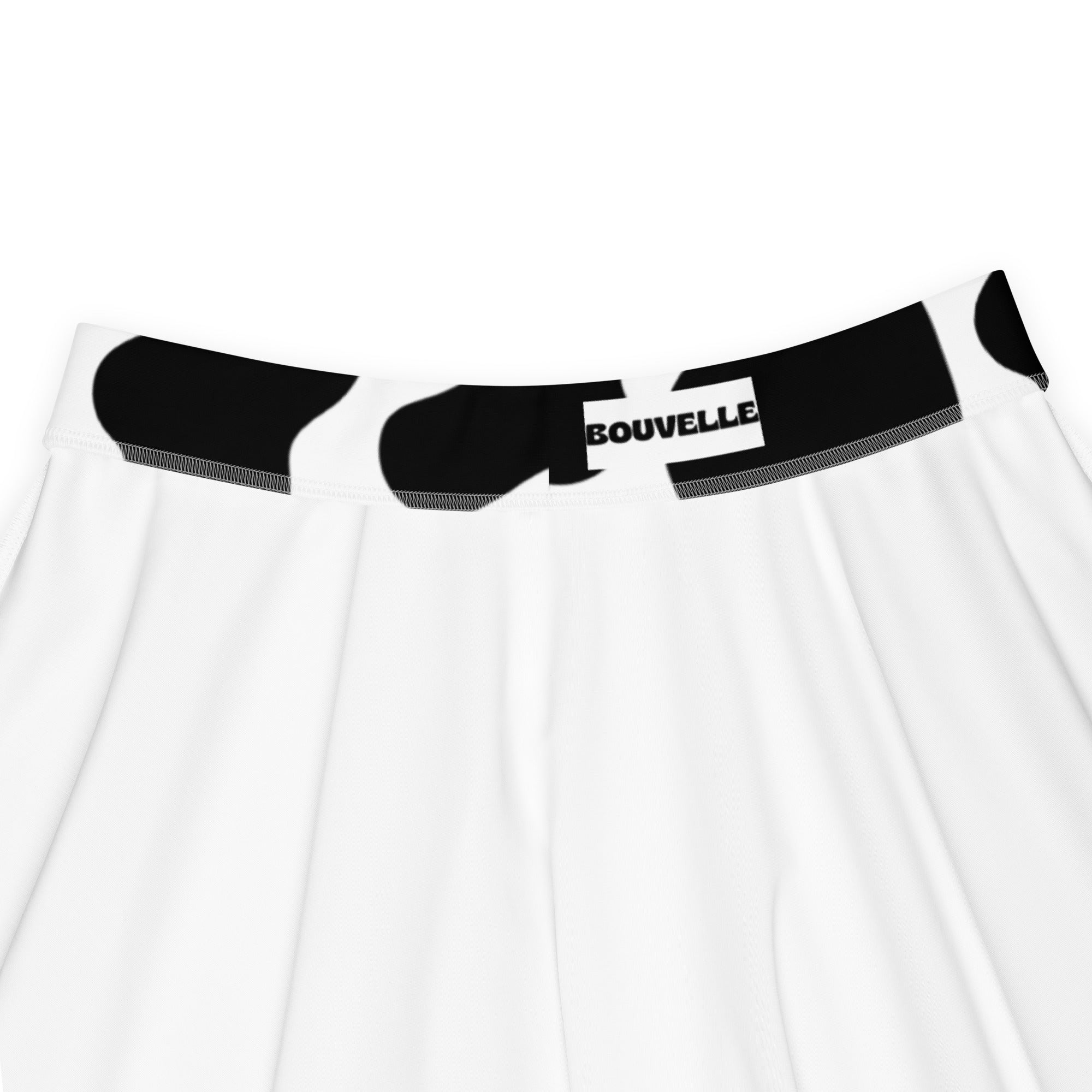 White skirt with black cow print belt and bouvelle logo patch high waisted skater skirt with upf 50 plus recycled fabric