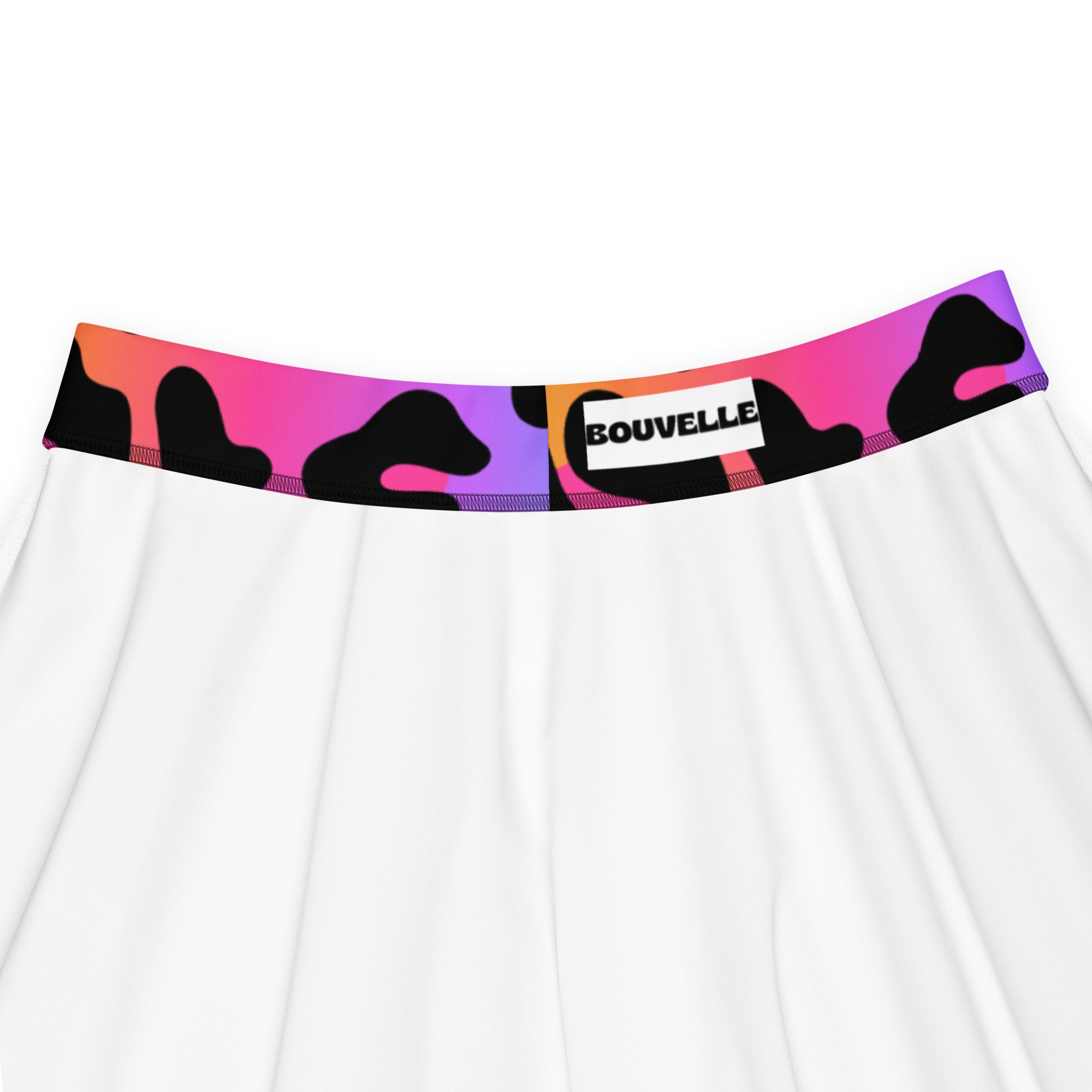 White skater skirt with vibrant abstract pink purple orange camouflage waistband and bouvelle label in recycled fabric