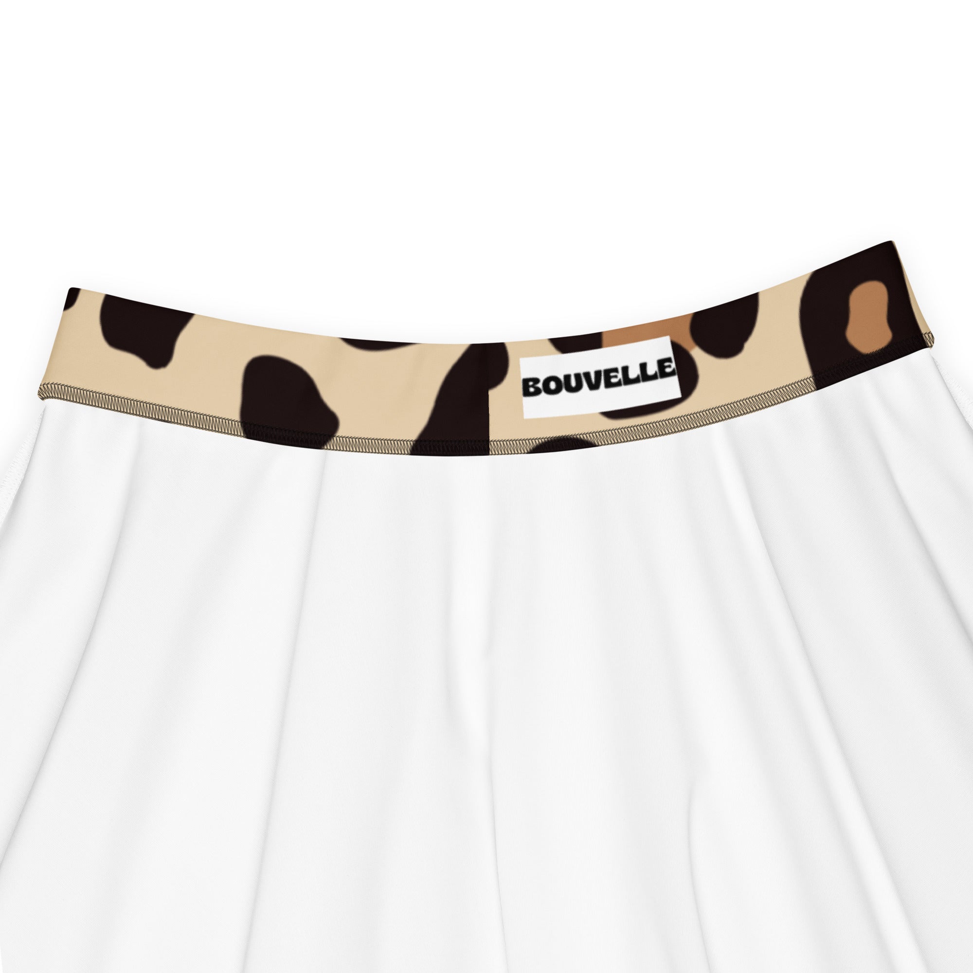 White skater skirt with beige and black leopard print waistband and bouvelle label made from recycled fabric with upf 50+