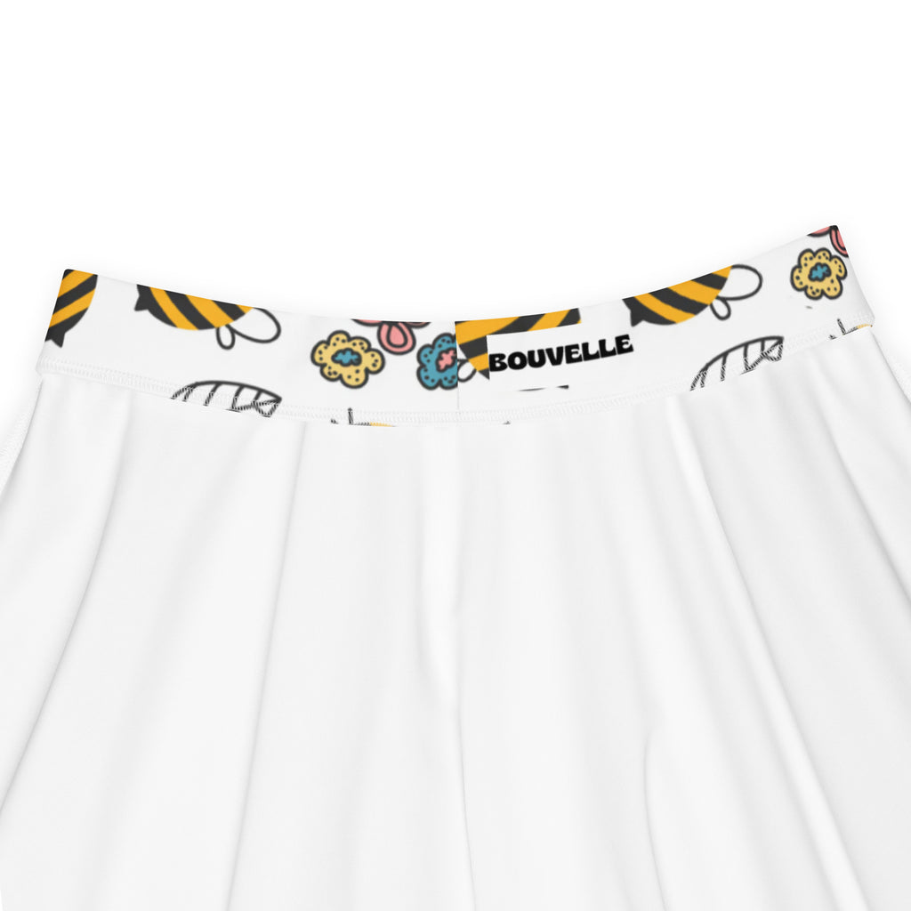 White pleated women’s skater skirt with colorful bumblebee floral waistband by bouvelle made from recycled fabric