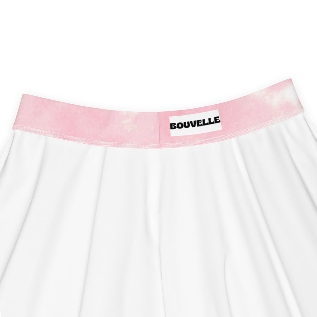 White pleated womens skater skirt with pink tie dye waistband and bouvelle label made from recycled fabric with upf 50+