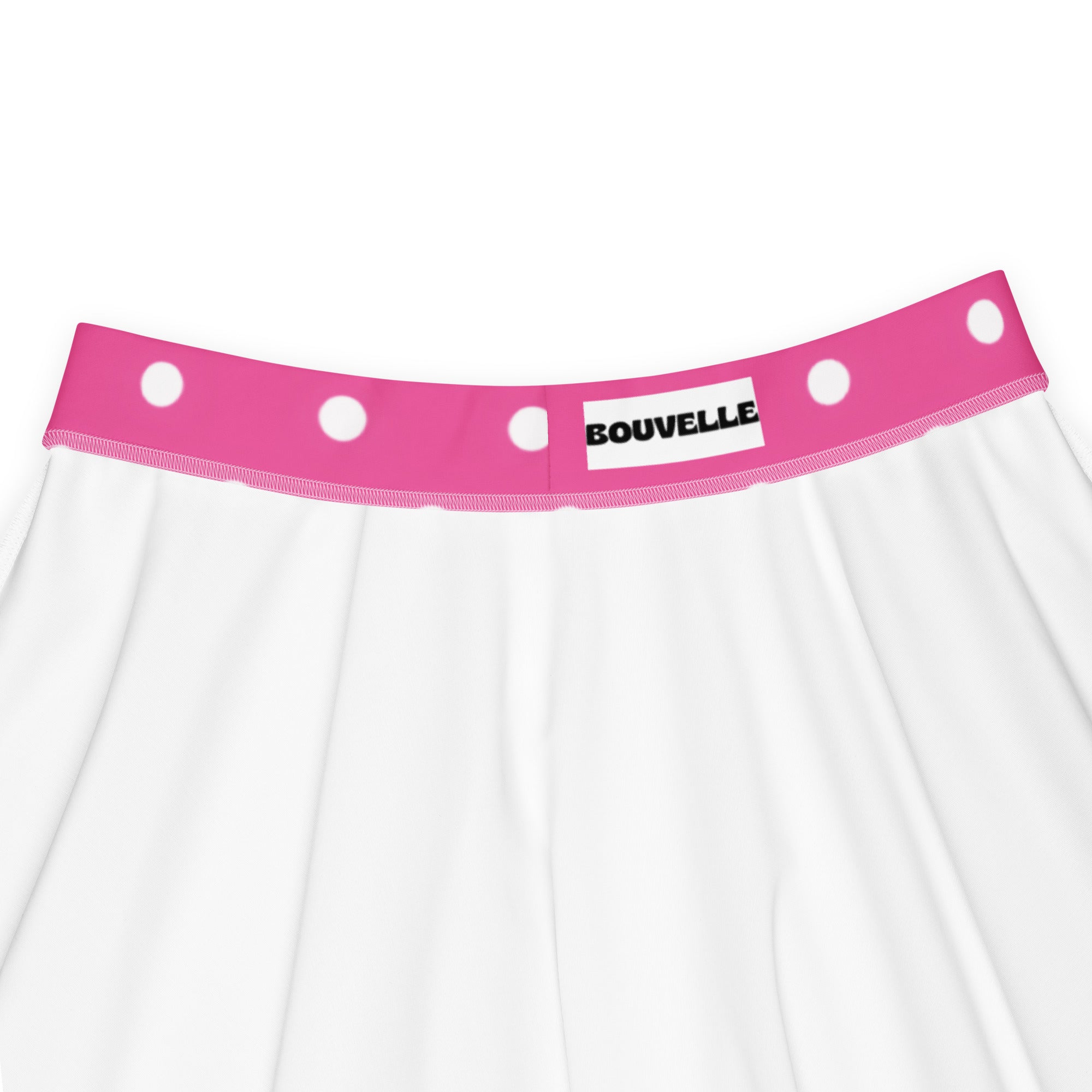 White skirt with vibrant pink polka dot waistband branded bouvelle flowy high waisted upf 50 plus recycled fabric