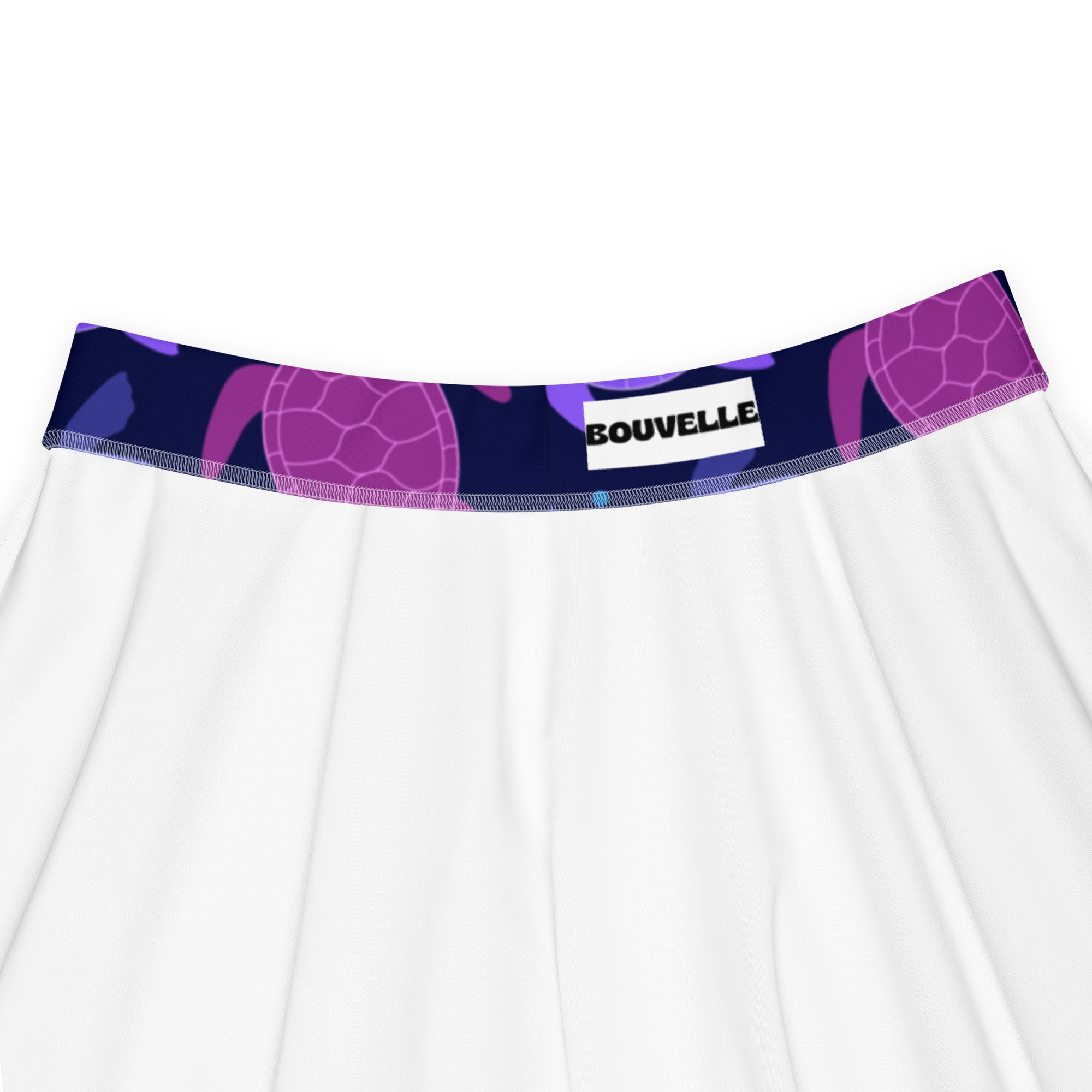 White skirt with navy blue and purple sea turtle patterned waistband from bouvelle high waisted skater skirt with upf 50+