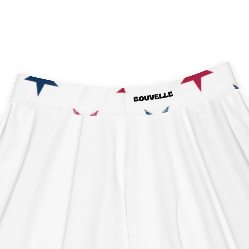 White pleated skater skirt with red and blue triangle logos on waistband by bouvelle high waisted flowy upf 50+ recycled fabric