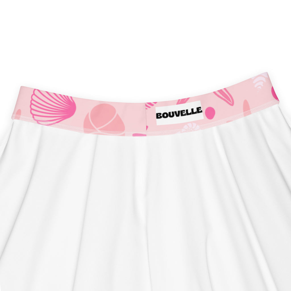 White skater skirt with pink shell patterned waistband branded bouvelle made from recycled fabric with upf 50+