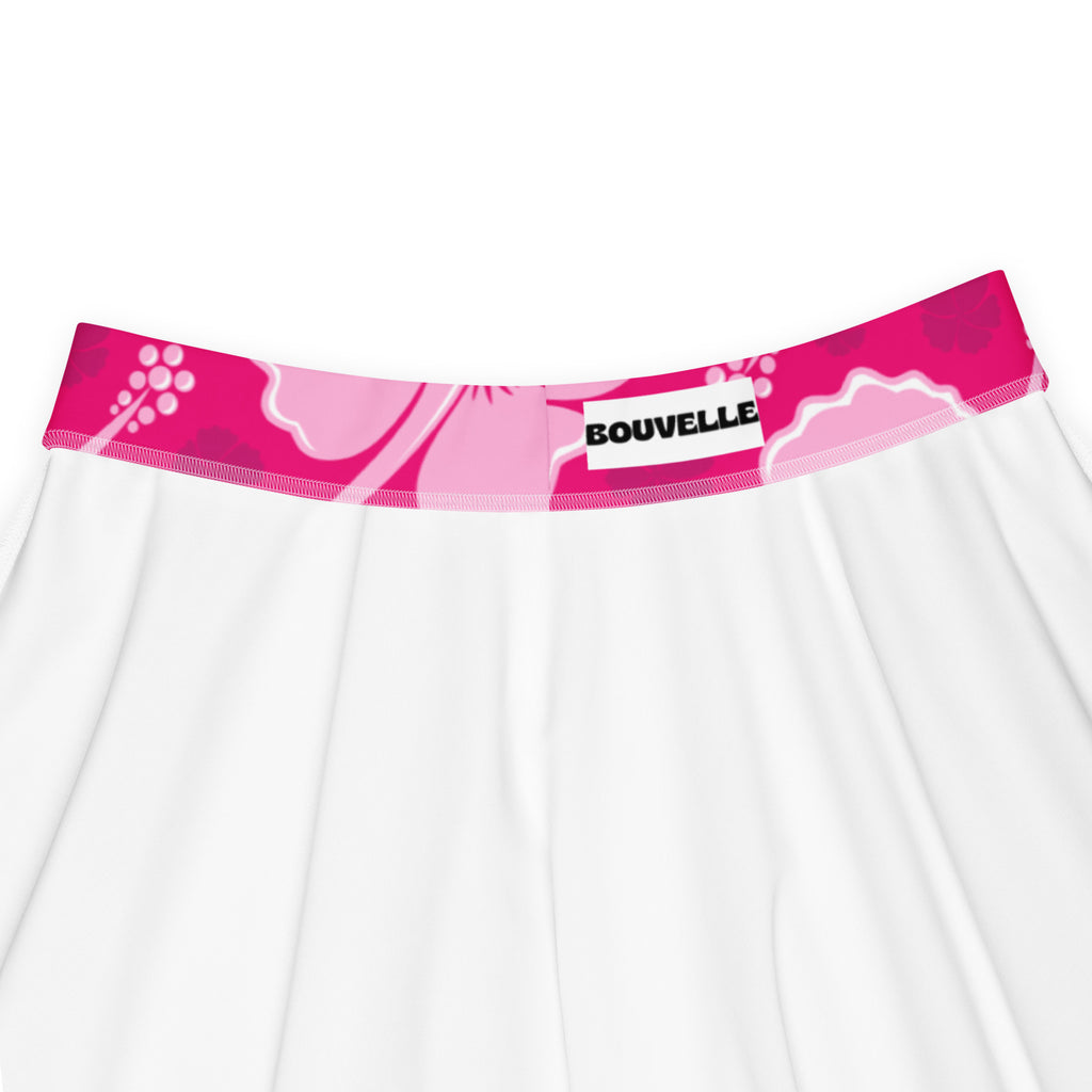 White skirt with vibrant pink floral waistband featuring bouvelle label flowy high waisted with upf 50 recycled fabric