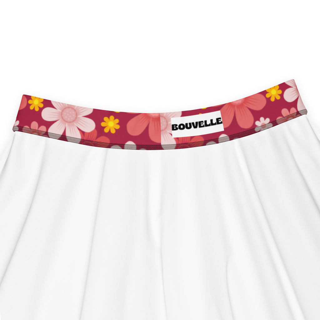 White floral-patterned underwear with red waistband featuring pink and yellow flowers branded bouvelle